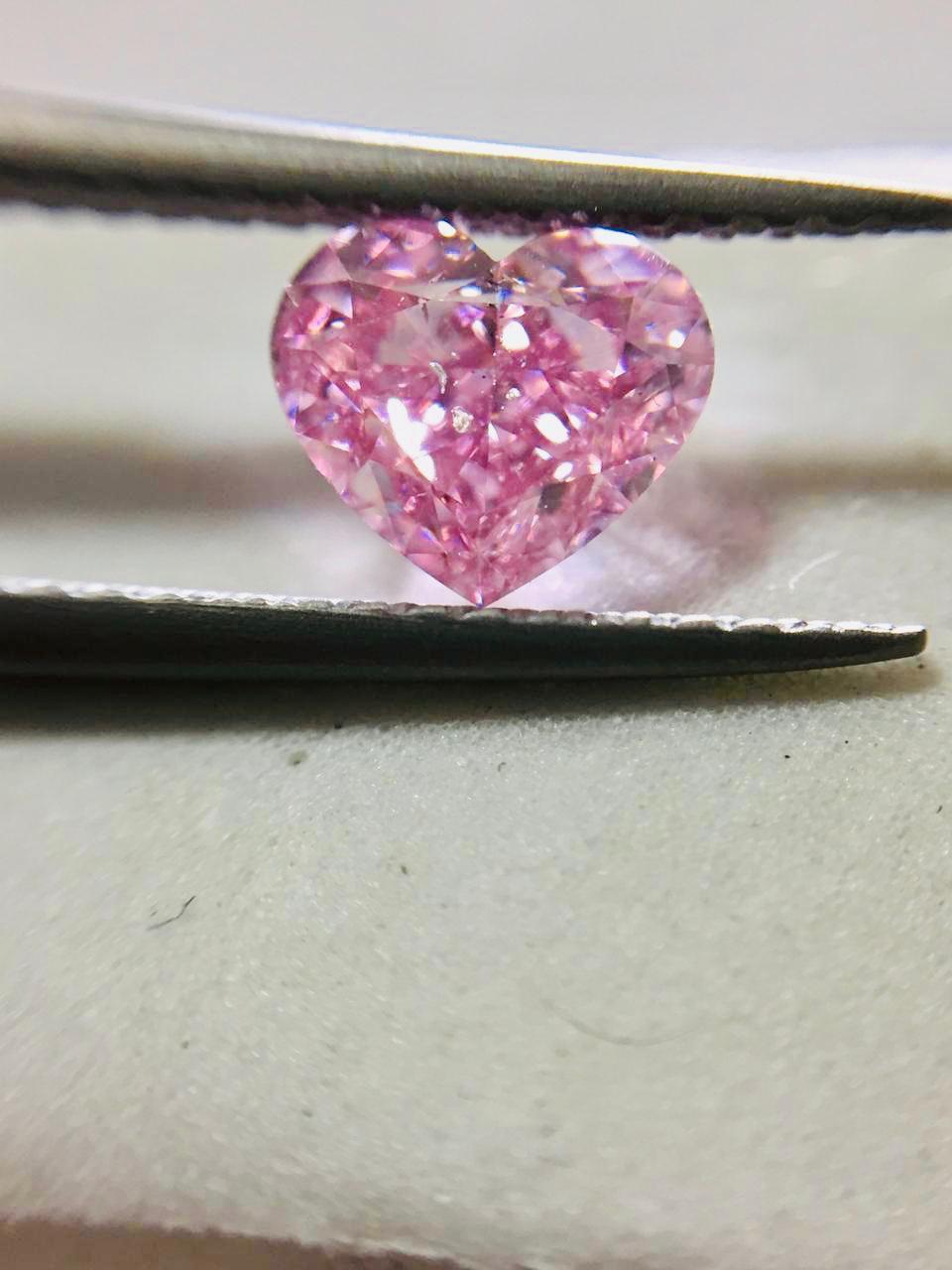 From the Emilio Jewelry Museum Vault, Showcasing a magnificent investment grade 1.00 carat certified Vivid Purplish Pink heart shaped diamond. What makes this diamond even more special, is the very sweet bubble gum vivid color the purplish overtone