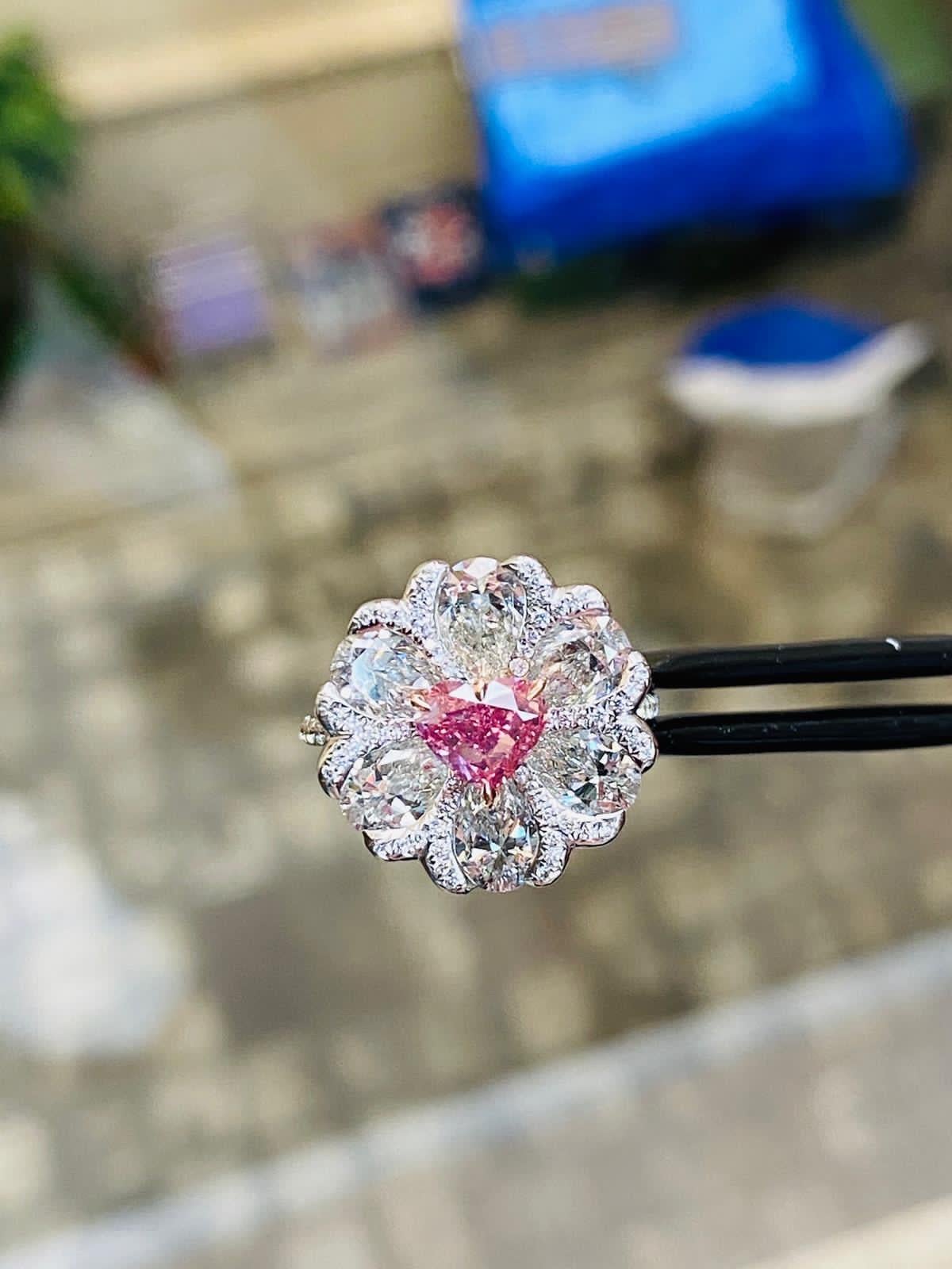 From the Emilio Jewelry Museum Vault, Showcasing a stunning Gia certified 1.00  Natural Fancy vivid  purplish pink heart shape diamond in the center. This is an extremely rare pink diamond, as the color saturation is Vivid, which is the best grading