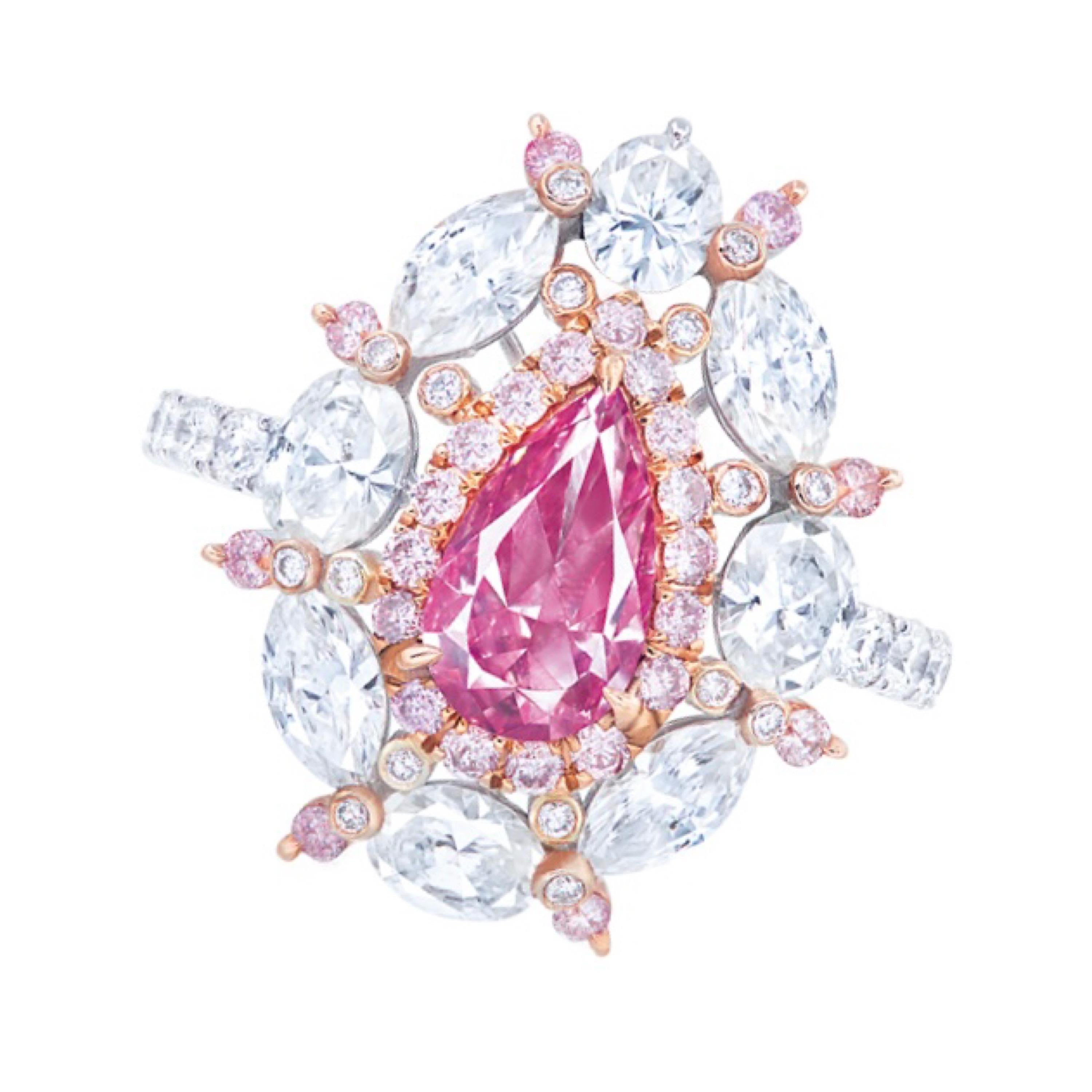 Main stone: 1.00 carats
Color: Fancy Vivid Purplish Pink
Shape: PEAR
Setting: 42 white diamonds with a total of about 0.262 carats, 12 white diamonds with a total of about 0.419 carats, 4 fancy turner marquise diamonds with a total of about 0.798