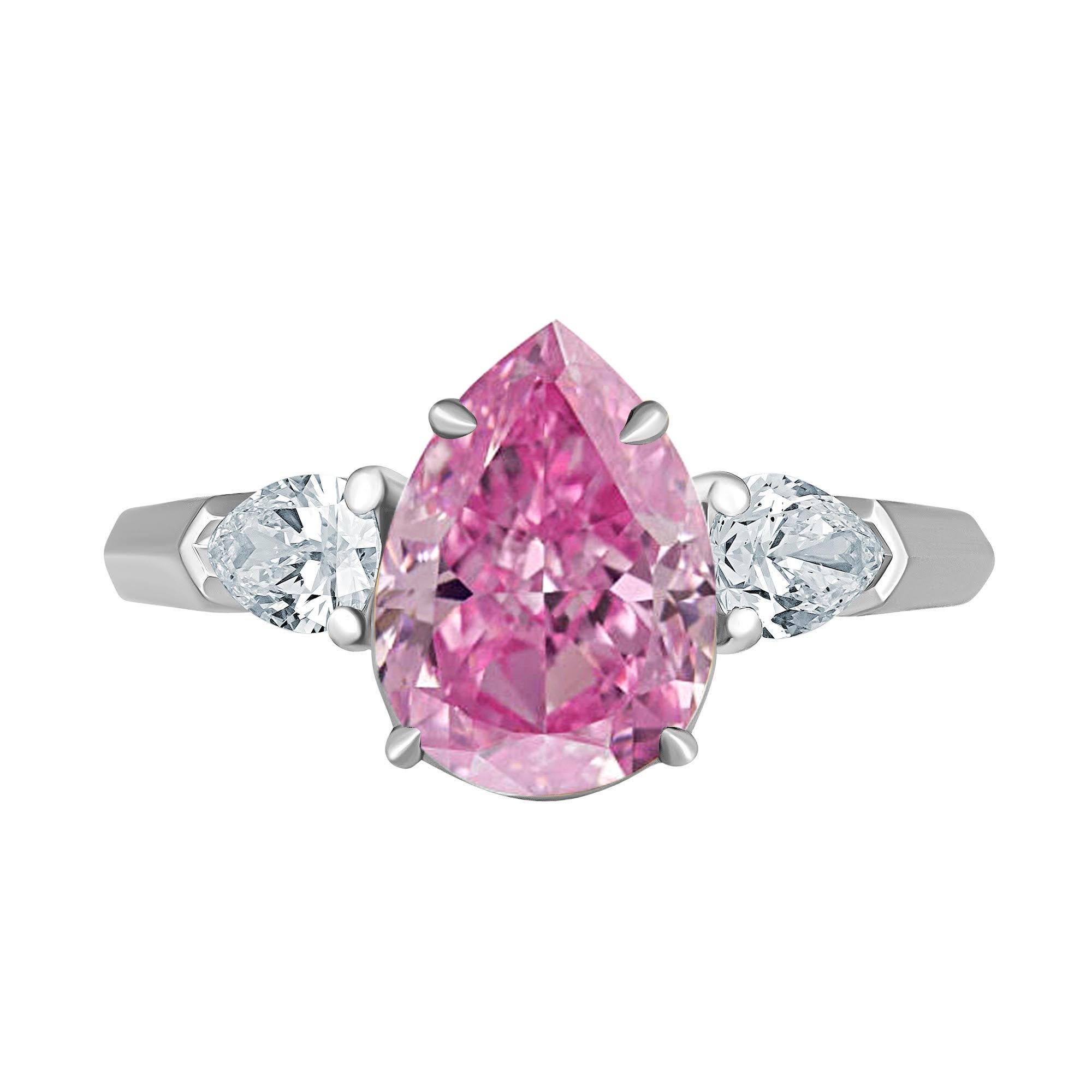 From the Museum vault at Emilio Jewelry, Located On New York’s Iconic Fifth Avenue:
Showcasing a magnificent natural Gia certified natural Fancy Vivid Purplish Pink Pear shape diamond Set in Platinum. This ultra rare center stone has an ultra sweet