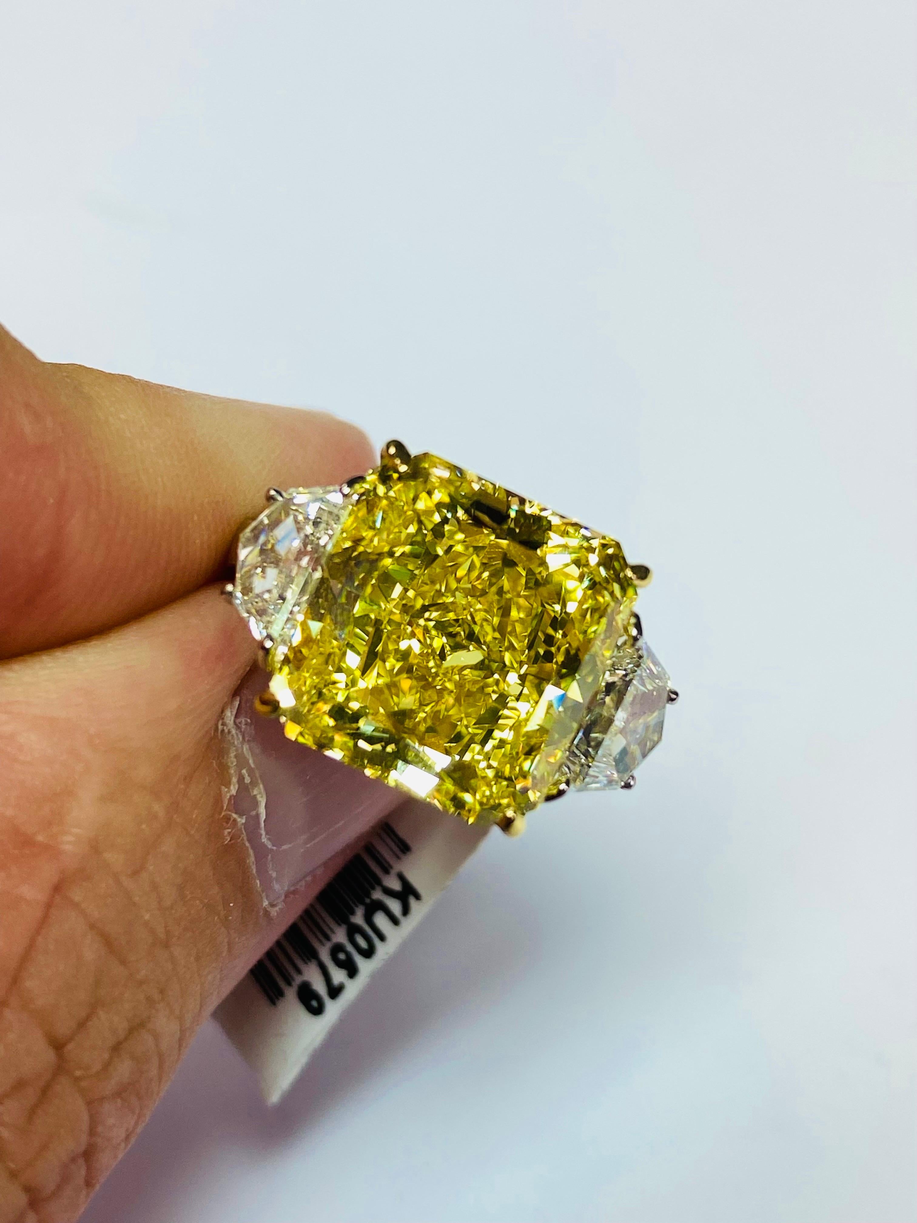 From Emilio Jewelry, a well known and respected wholesaler/dealer located on New York’s iconic Fifth Avenue,
The focal point of this ring is featuring a Gia certified natural Fancy Vivid Pure Yellow Diamond with a true golden color! 
Total weight