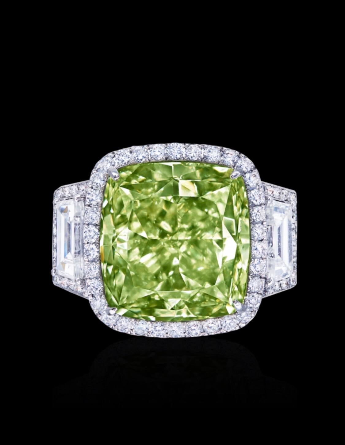 Showcasing a very special certified 12 carat clean natural yellow green diamond ring certified by GIA. Because Green is the last word on the certificate that makes it the primary color and yellow just a slight overtone. Green diamonds are very rare,