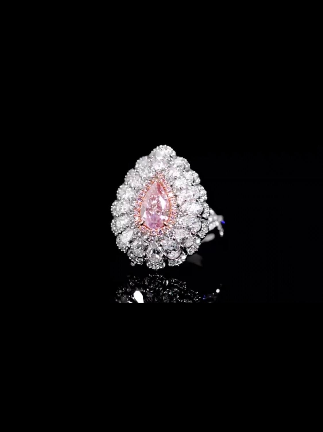 From the Emilio Jewelry Vault, Showcasing a magnificent 1.20 carat Gia certified natural fancy pinkish purple diamond set in the center. The Argyle mines are closed, with no more production this is surely a great investment which will steadily