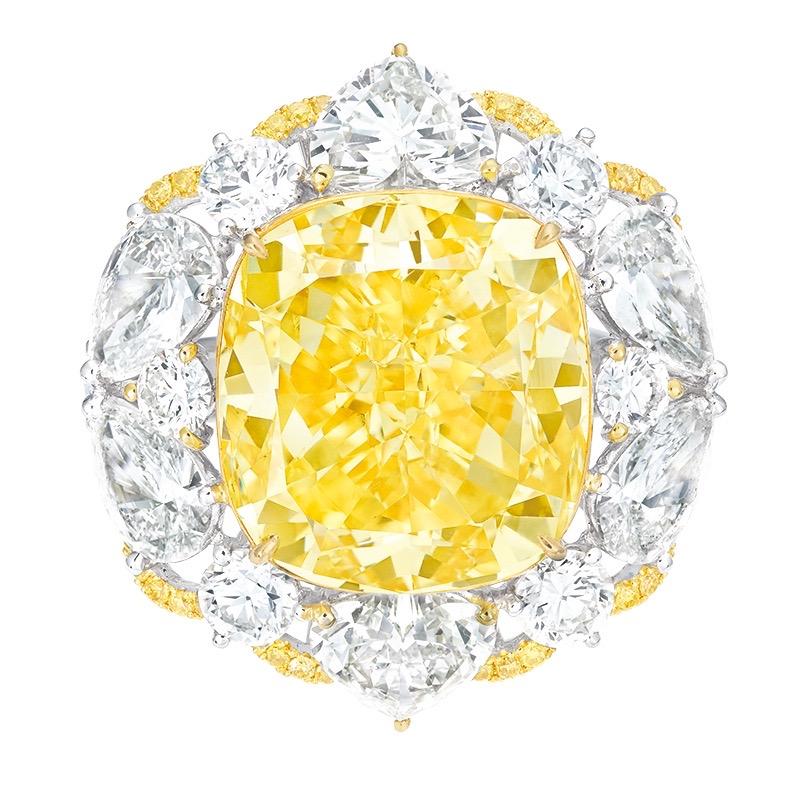 Main stone: 13.11 carats
Color: Fancy Yellow
Clarity: SI1
Shape: CUSHION
Setting: 8 fancy-cut white diamonds totaling approximately 3.38 carats, 36 yellow diamonds totaling approximately 0.166 carats, 42 white diamonds totaling approximately 1.125