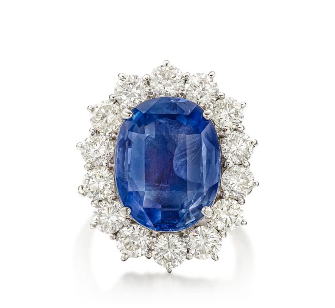 From respected and well known dealer Emilio Jewelry New York,

This ring is nothing but spectacular! Featuring a lovely untreated ceylon sapphire center, Gia Certified. The ring is set in Platinum. Total weight is shown in the description. 
Center