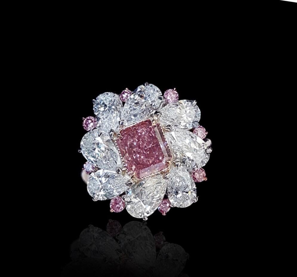 From the Emilio Jewelry Museum Vault, We are Showcasing a Gia certified 1.50 carat natural fancy intense pink diamond in the center. The diamond is exceptional and clean. Please inquire for the video. 
This piece was Hand made in the Emilio Jewelry