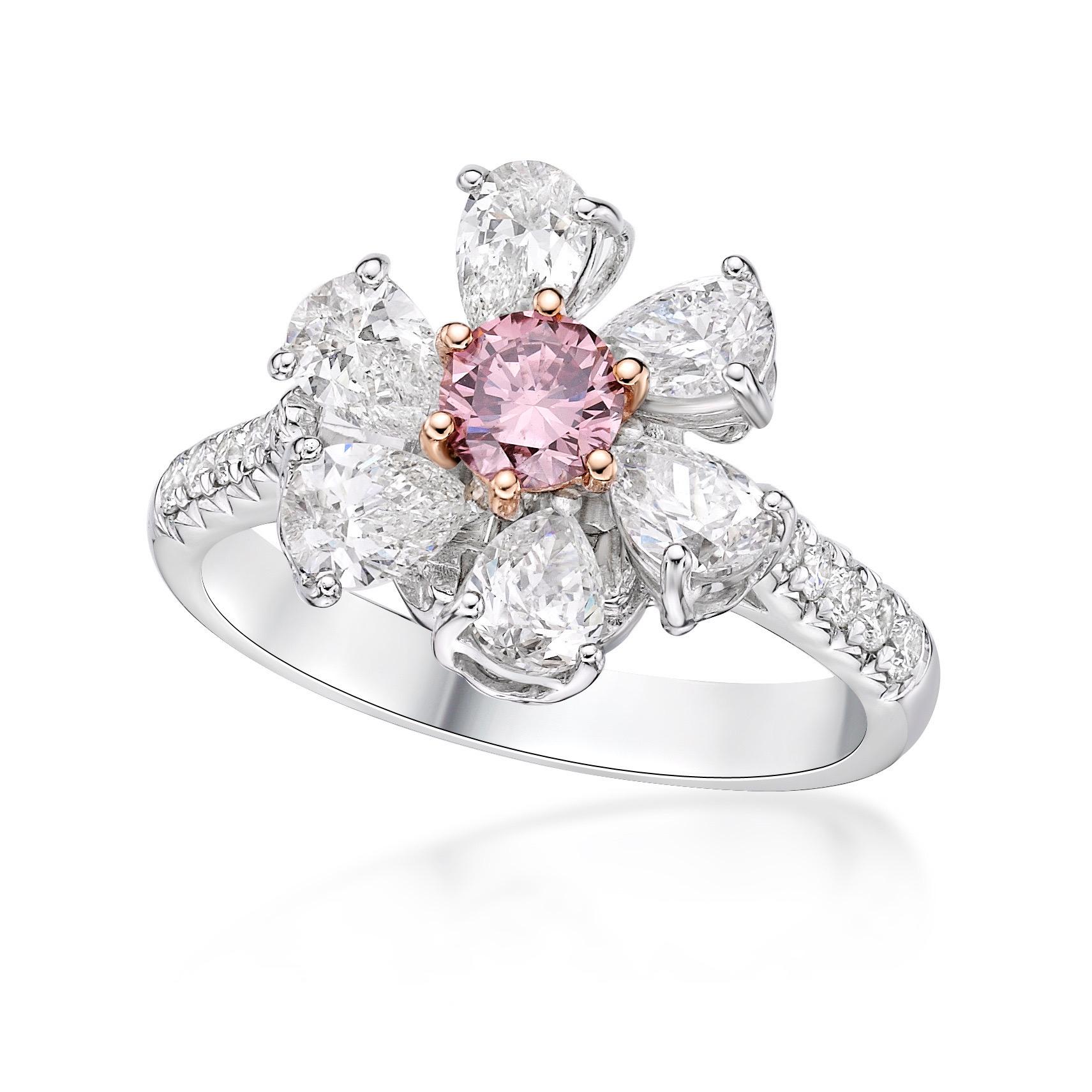 6 pear shape diamonds 1.45ct
Center: natural fancy pink diamond .35ct 
12 small diamonds totaling .22ct

From The Museum Vault at Emilio Jewelry Located on New York's iconic Fifth Avenue,
Showcasing a very special and rare Gia certified natural pink