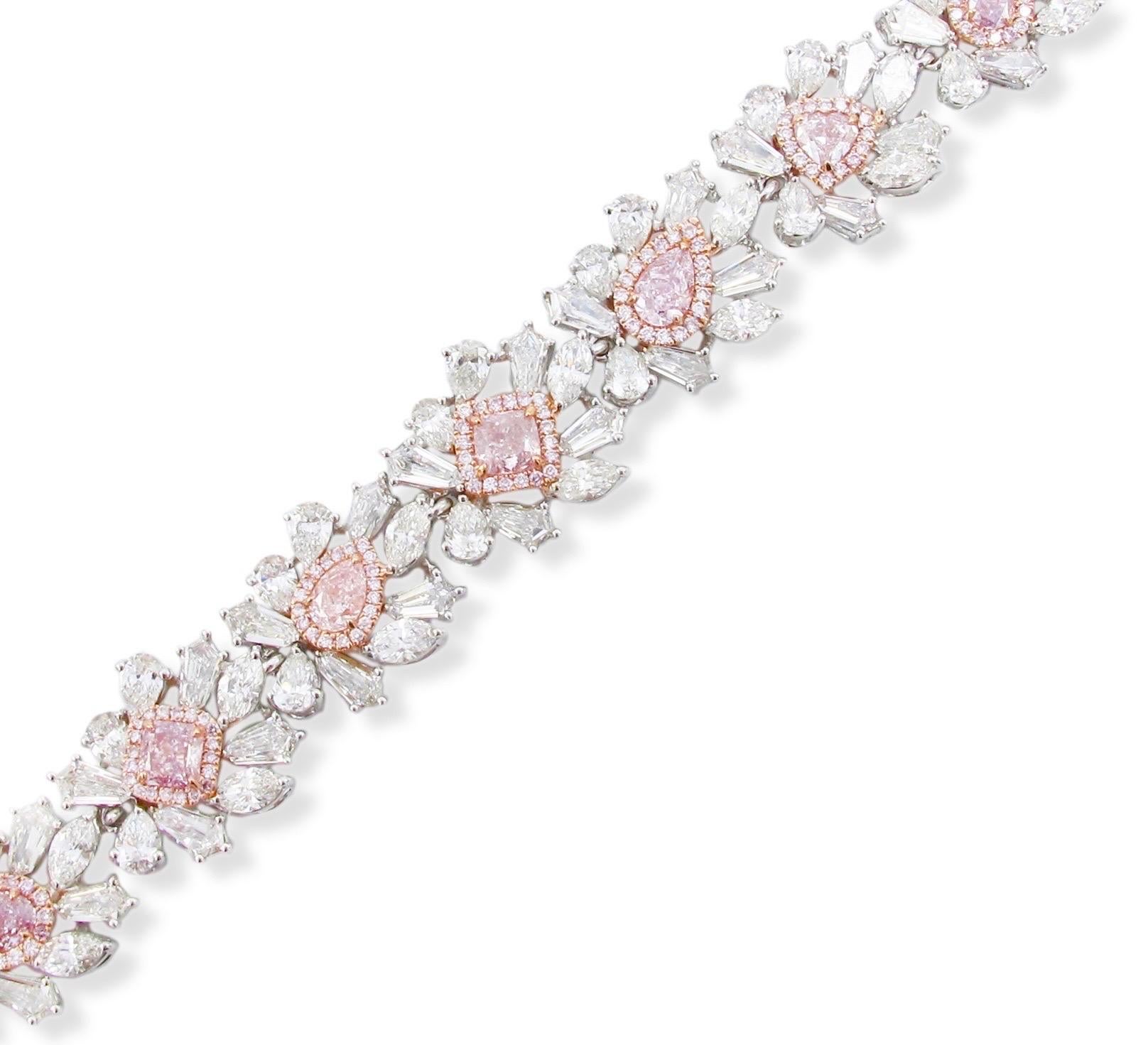 From The Vault at Emilio Jewelry Located on New York's iconic Fifth Avenue

Hand made with multi shapes of Natural pink and natural white exotic diamonds featuring heart, oval, cushion, pear shapes, radiant and round cut diamonds. This magnificent