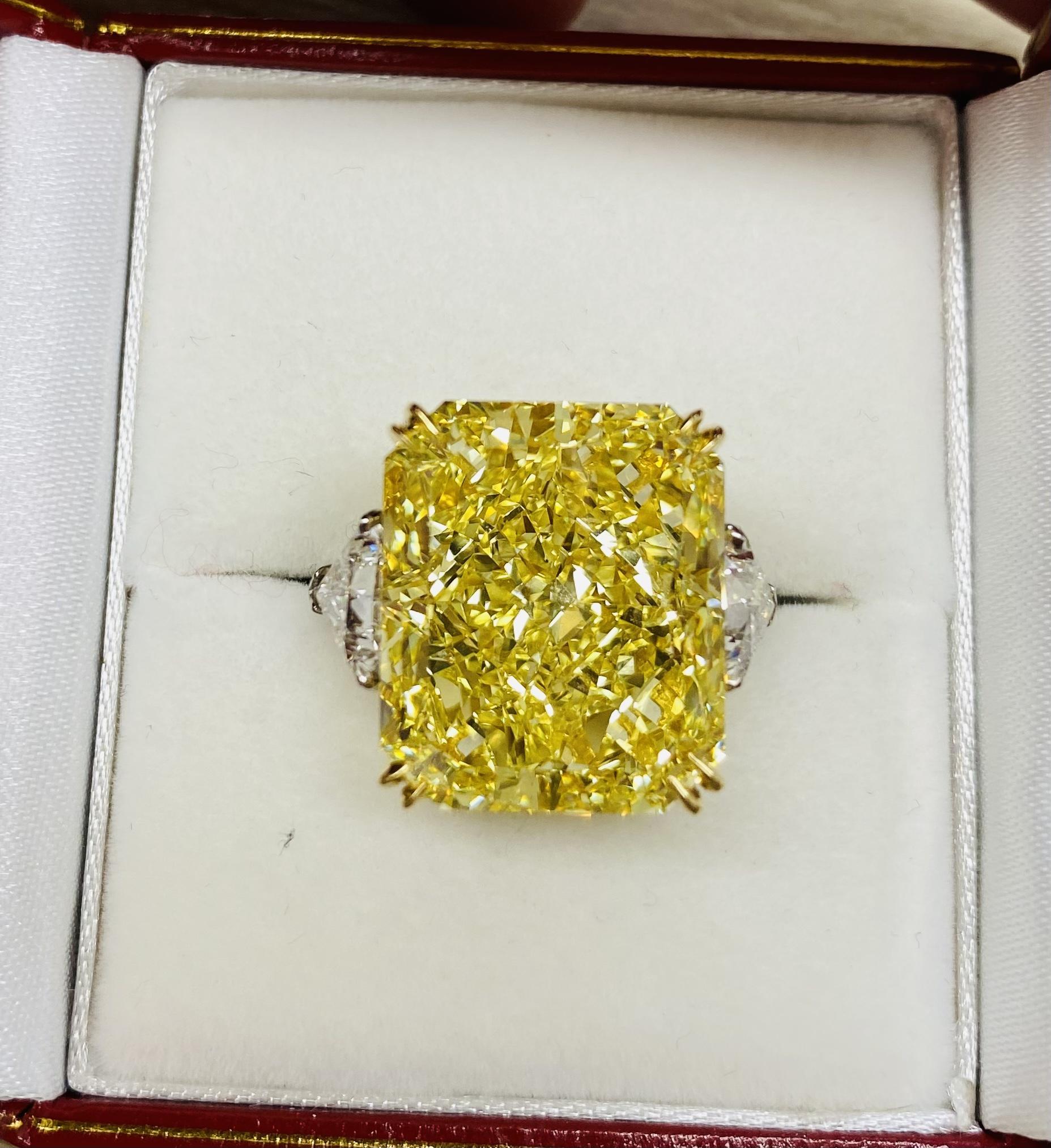 From Emilio Jewelry, a well known and respected wholesaler/dealer located on New York’s iconic Fifth Avenue, 
Spectacularly saturated and mind blowing Gia Certified Fancy Intense Yellow Diamond is the focal point of this ring. What makes it even