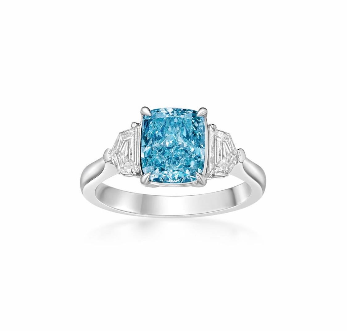 From Emilio Jewelry, a well known and respected wholesaler/dealer located on New York’s iconic Fifth Avenue, 
2.73 Carat total weight rare investment piece, featuring a Gia certified natural Fancy Intense Bluish Green diamond set in the center.