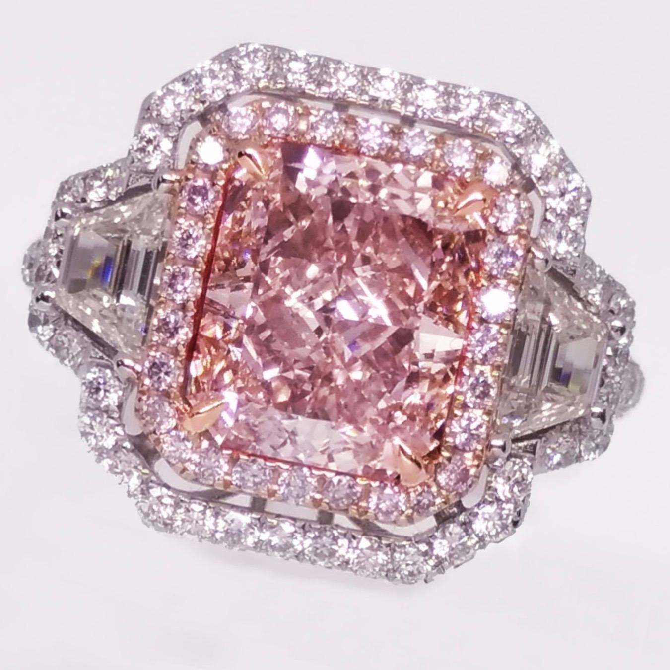 From the Emilio Jewelry Museum Vault, We are Showcasing a stunning 3.00 carat center Gia Certified natural light brown pink. This rings primary color according to the Gia report is pink, and because of the brown overtone that reduces the price