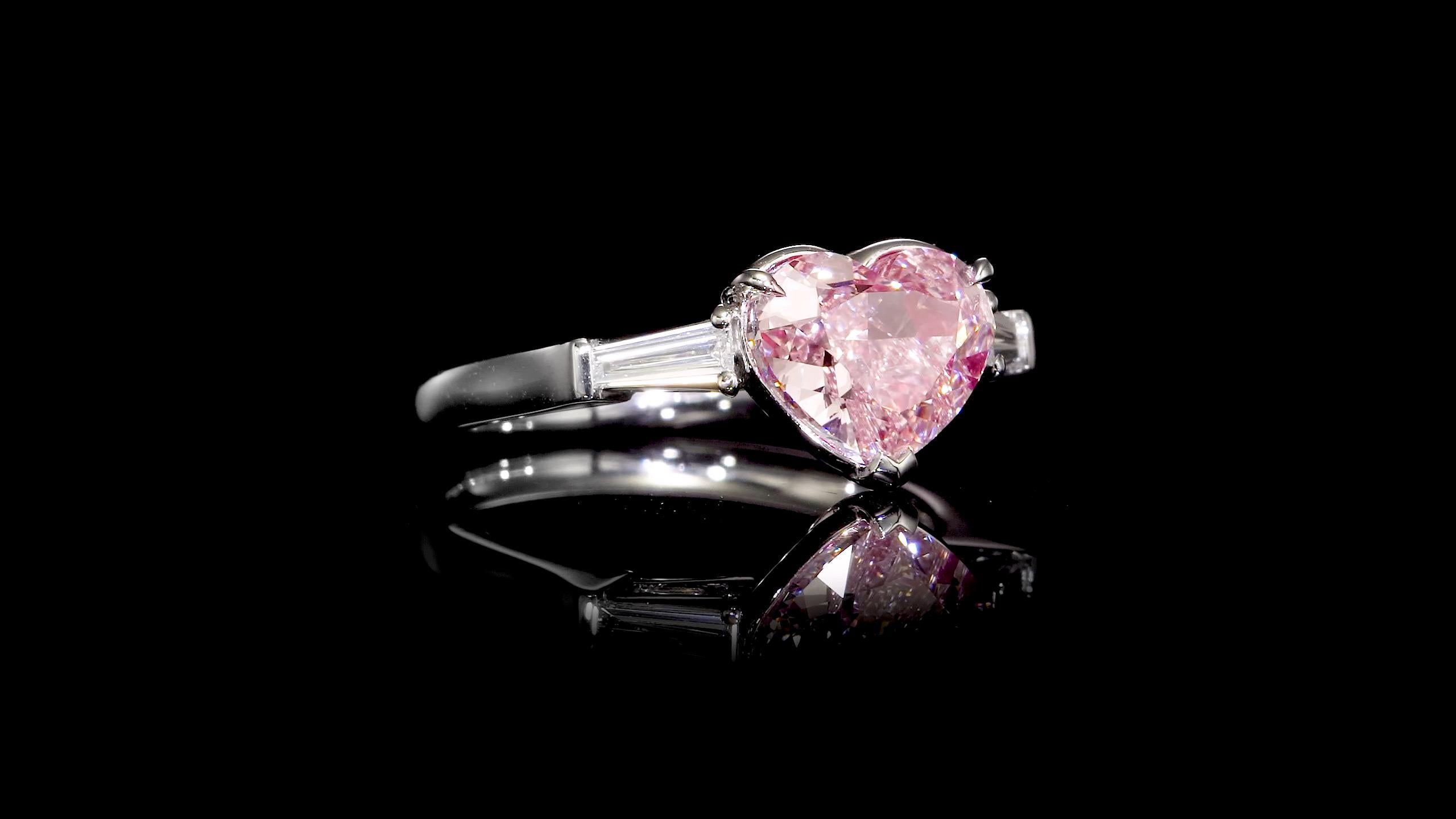 Another hand made masterpiece from the Museum Vault At Emilio Jewelry, located on New York's iconic Fifth Avenue. Featuring a very unique Gia certified natural fancy light pink center diamond weighing over 3 carats alone. With our expertise this