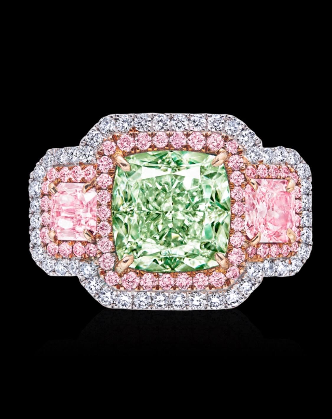 From the Emilio Jewelry Museum Vault, We are Showcasing a stunning 3.00 carat center Gia Certified natural fancy light pure green diamond center, with no secondary color flanked by natural fancy light pink diamonds on the side .70ct. Emilio is an