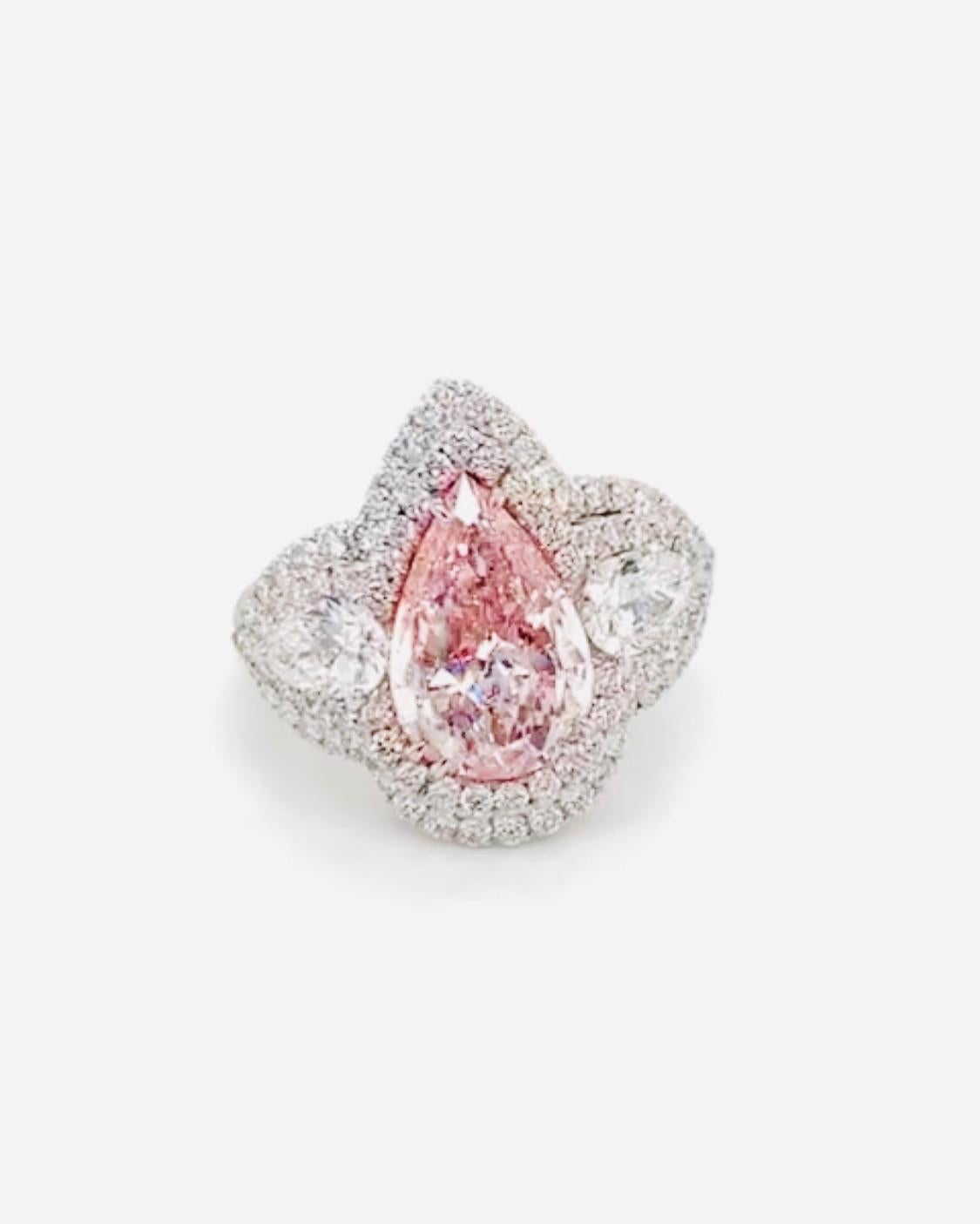 From the Emilio Jewelry museum vault in New York, at wholesale prices..
A gorgeous hand made ring featuring this sweet bubble gum color natural pink diamond ring. The center alone weighs just over 3.00 carats. Very fine piece, please inquire for