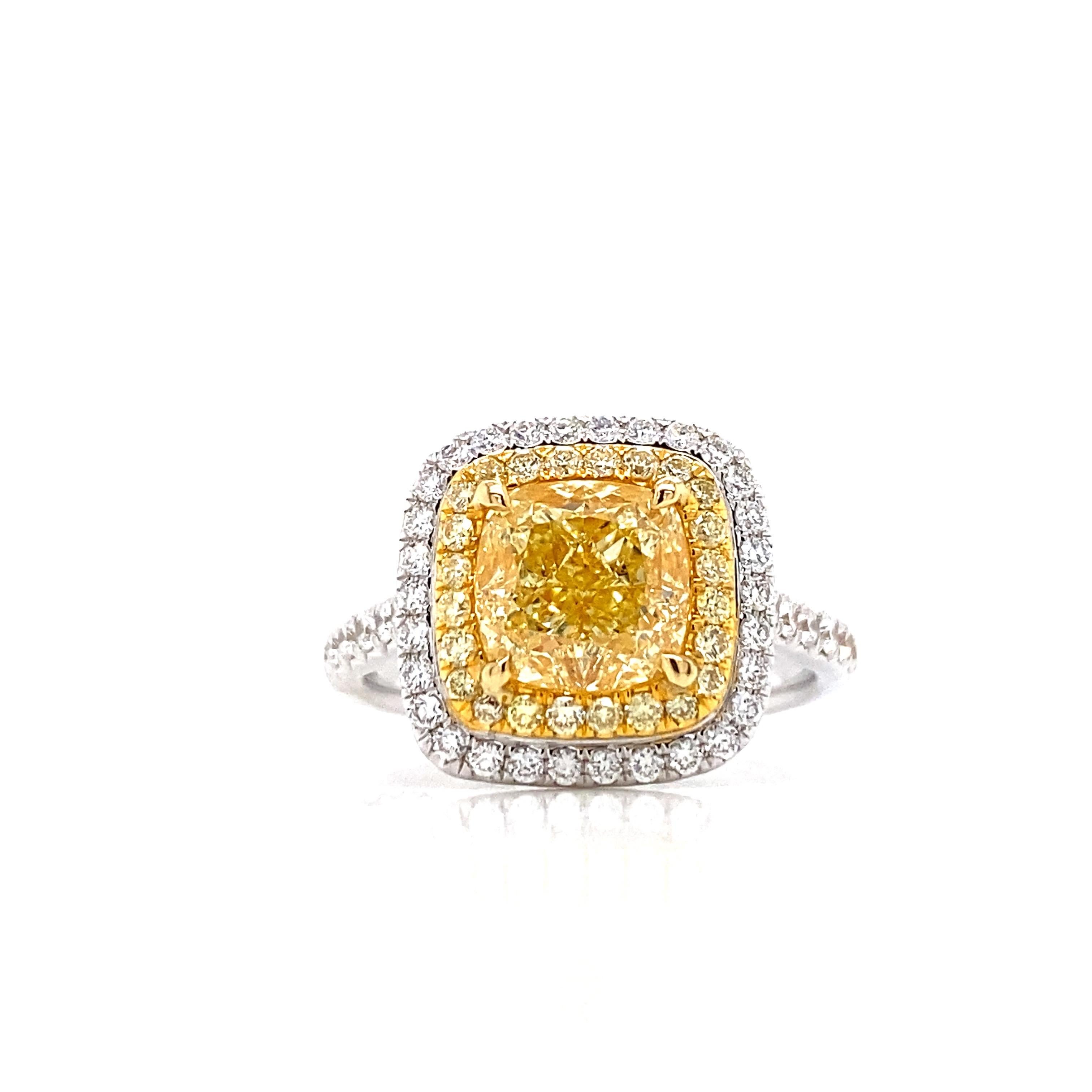 From the Vault at Emilio Jewelry, located on New York's iconic 5th Avenue,
Center stone: a gorgeous fancy yellow diamond weighing just over 2.30cts certified as fancy yellow with no overtone. Clarity vvs2! Set in 18k with another .70ct of F color