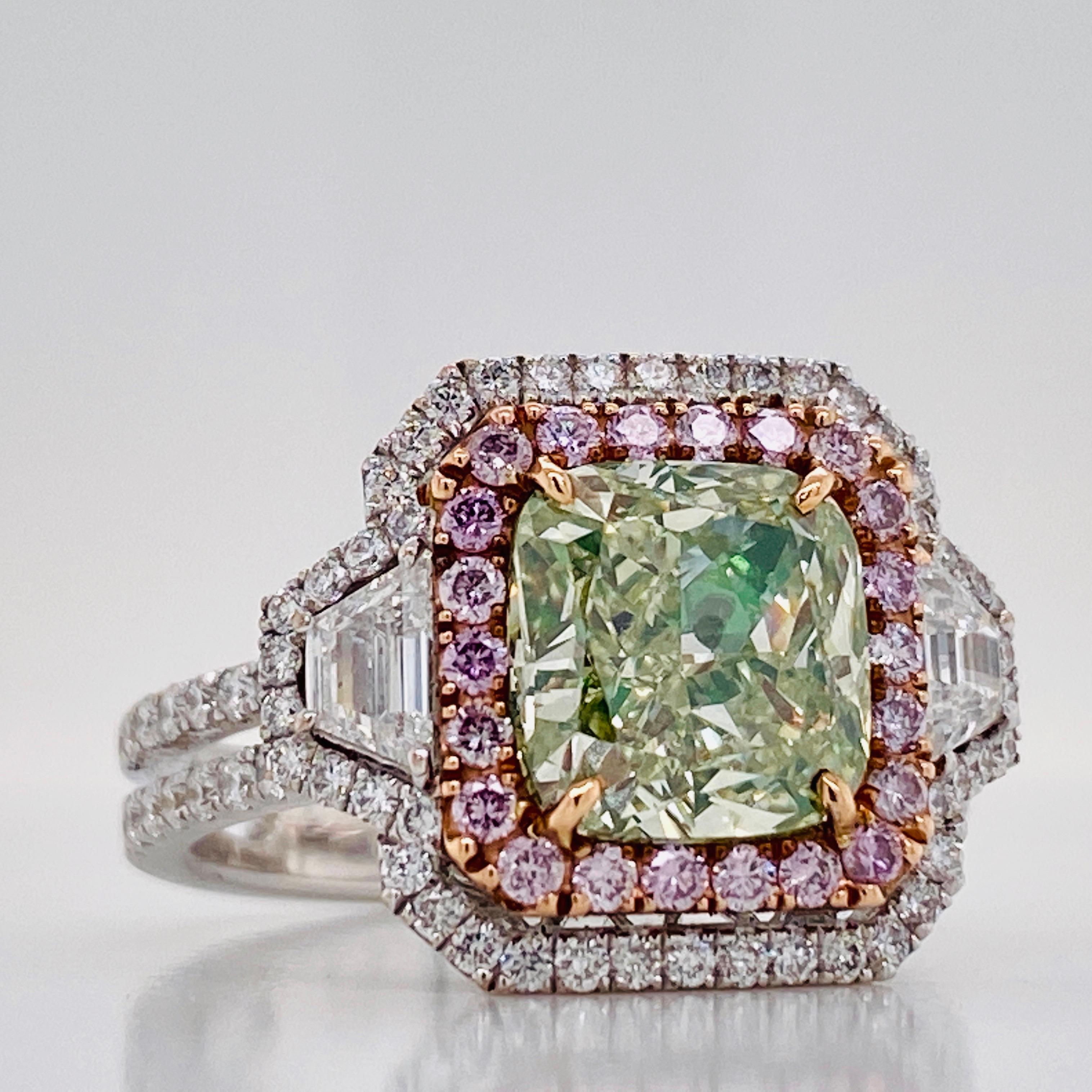 From the Emilio Jewelry Vault, Showcasing a magnificent 3.00 carat Gia certified natural fancy yellow green diamond set in the center. In addition the mounting consists of .25ct of pink diamonds, .55ct of round diamonds, .32ct of trapezoids. 
We are