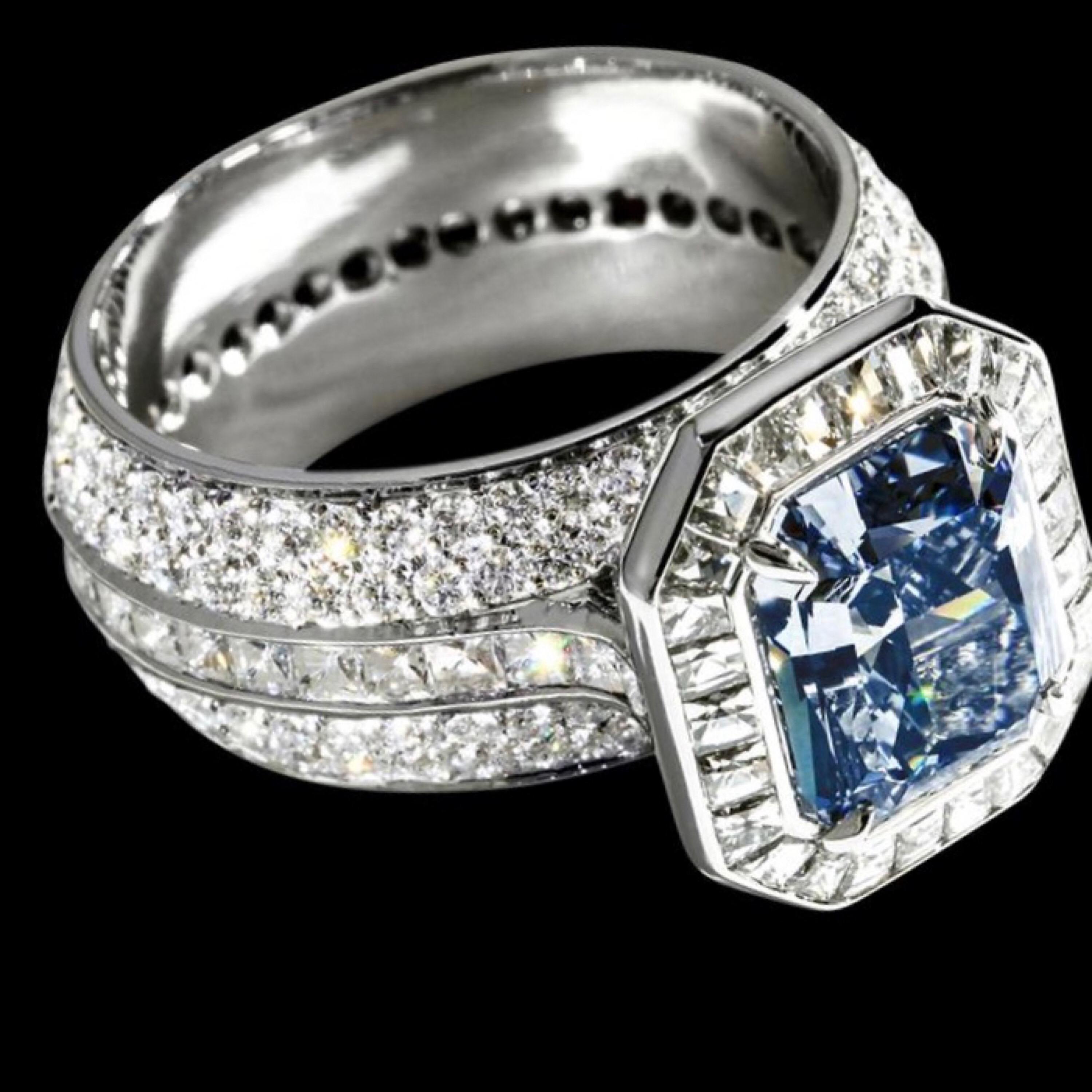 From the Emilio Jewelry Museum Vault, Showcasing a one and only natural fancy vivid blue diamond of 3.00 carats set in the center. This is perfect for the passionate collector who is looking for the Mona Lisa of natural blue diamonds. 
video