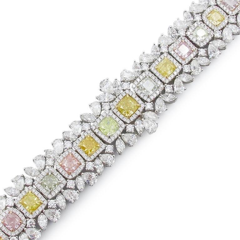 From Emilio Jewelry, a well known and respected wholesaler/dealer located on New York’s iconic Fifth Avenue, 
A one of a kind bracelet created with exotic rare Gia Certified natural fancy Pink orange green yellow and purple diamonds totaling 30.50
