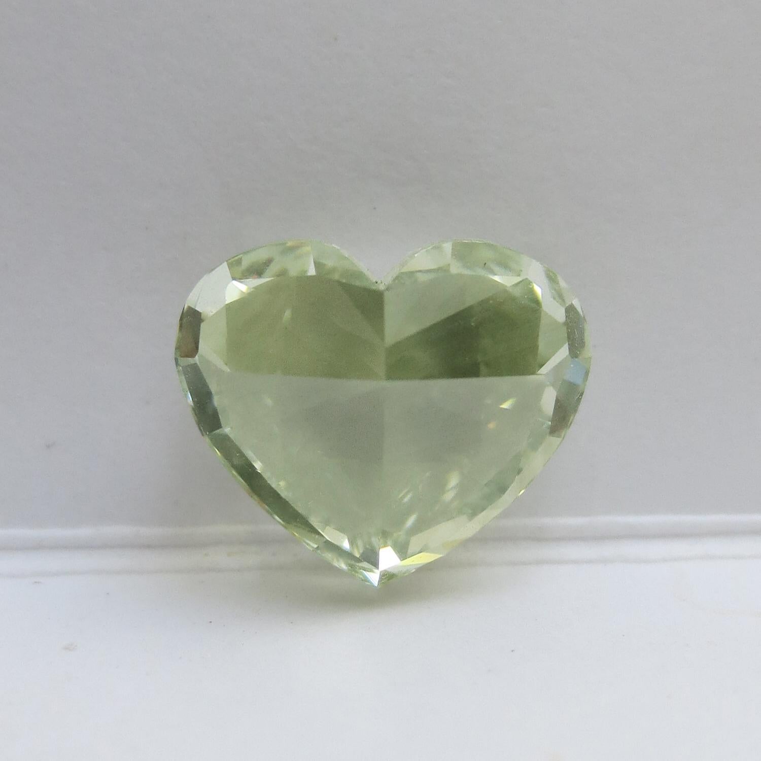 From the Emilio Jewelry Museum Vault, Showcasing a magnificent investment grade 3.50 carat Gia certified natural fancy yellowish green diamond heart. The only heart of its kind! Green diamonds of this caliber will be increasing in value steadily.
We