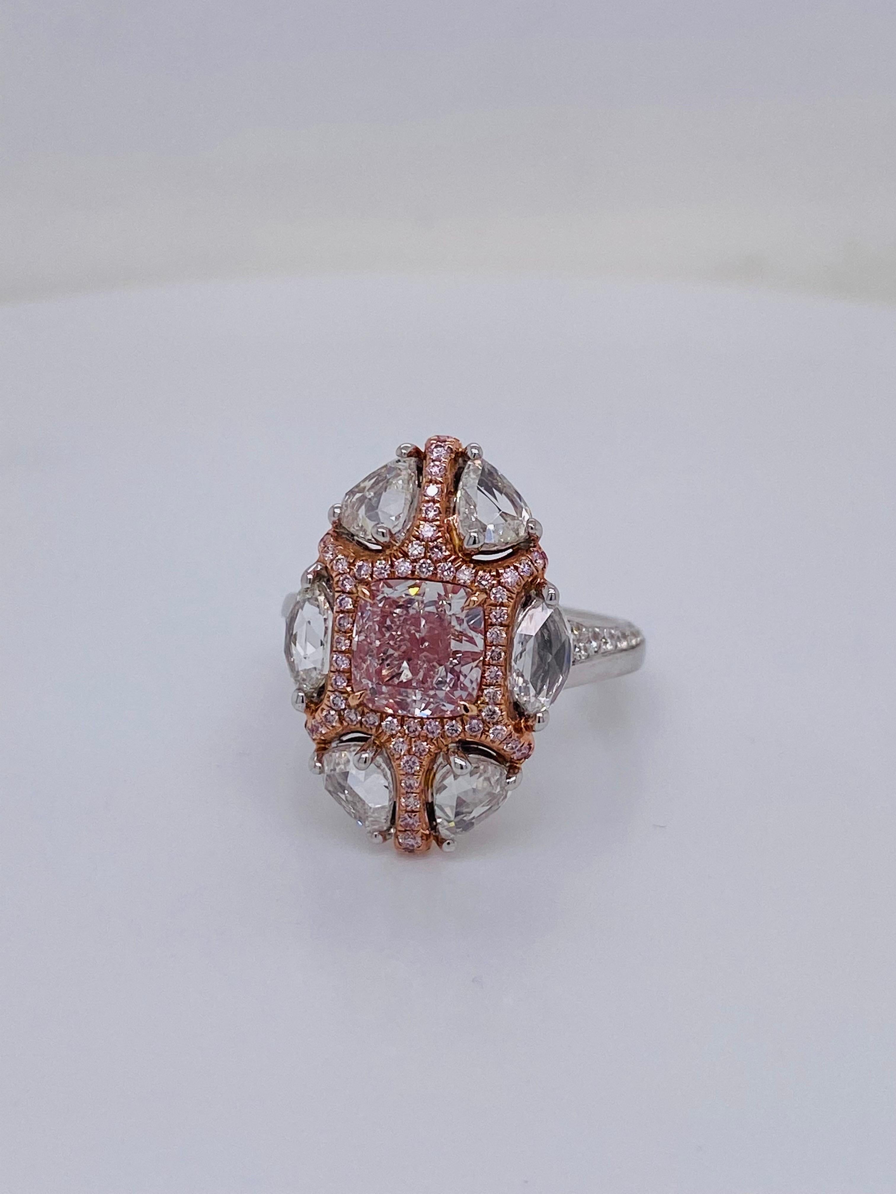 From the vault at Emilio Jewelry, Located On New York’s Iconic Fifth Avenue:
center diamond just over 1.70ct fancy faint pinkish brown set in a unique mounting featuring rose cut marquise, pink diamonds, and round white totaling approximately 2.30ct