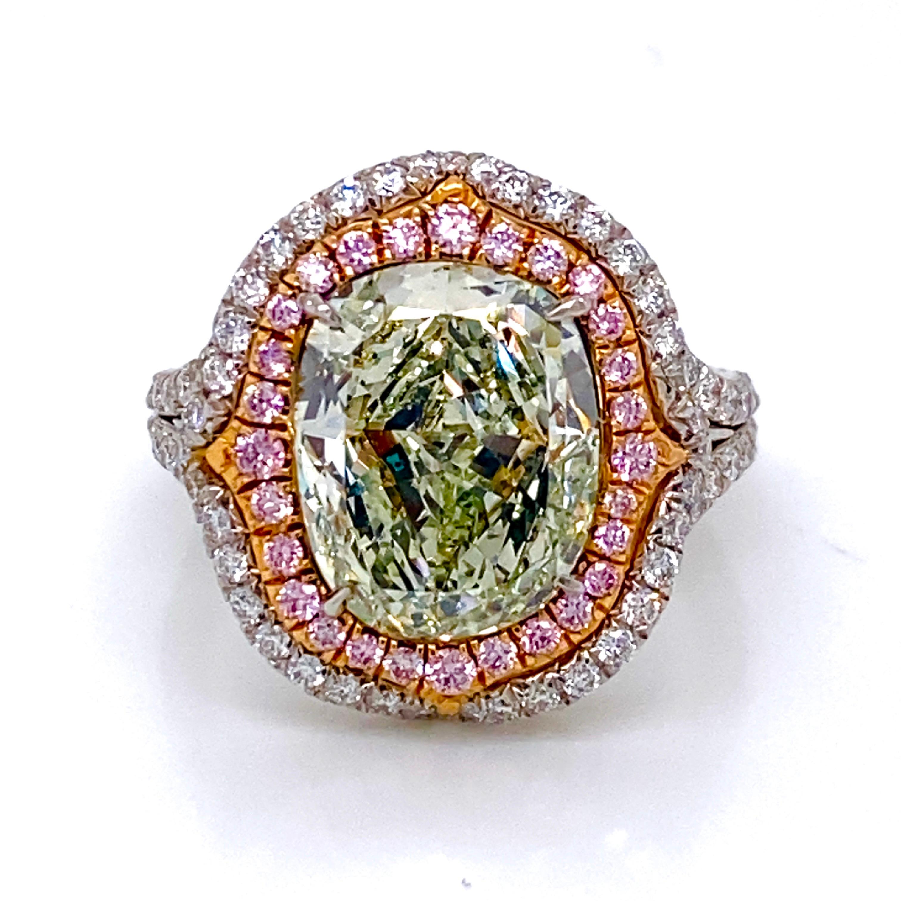 From the Emilio Jewelry Museum Vault, Showcasing a magnificent investment grade 4.50 carat natural fancy yellowish green diamond set in the center. A pure green diamond with no overtone would cost three times the price which is why this ring is a