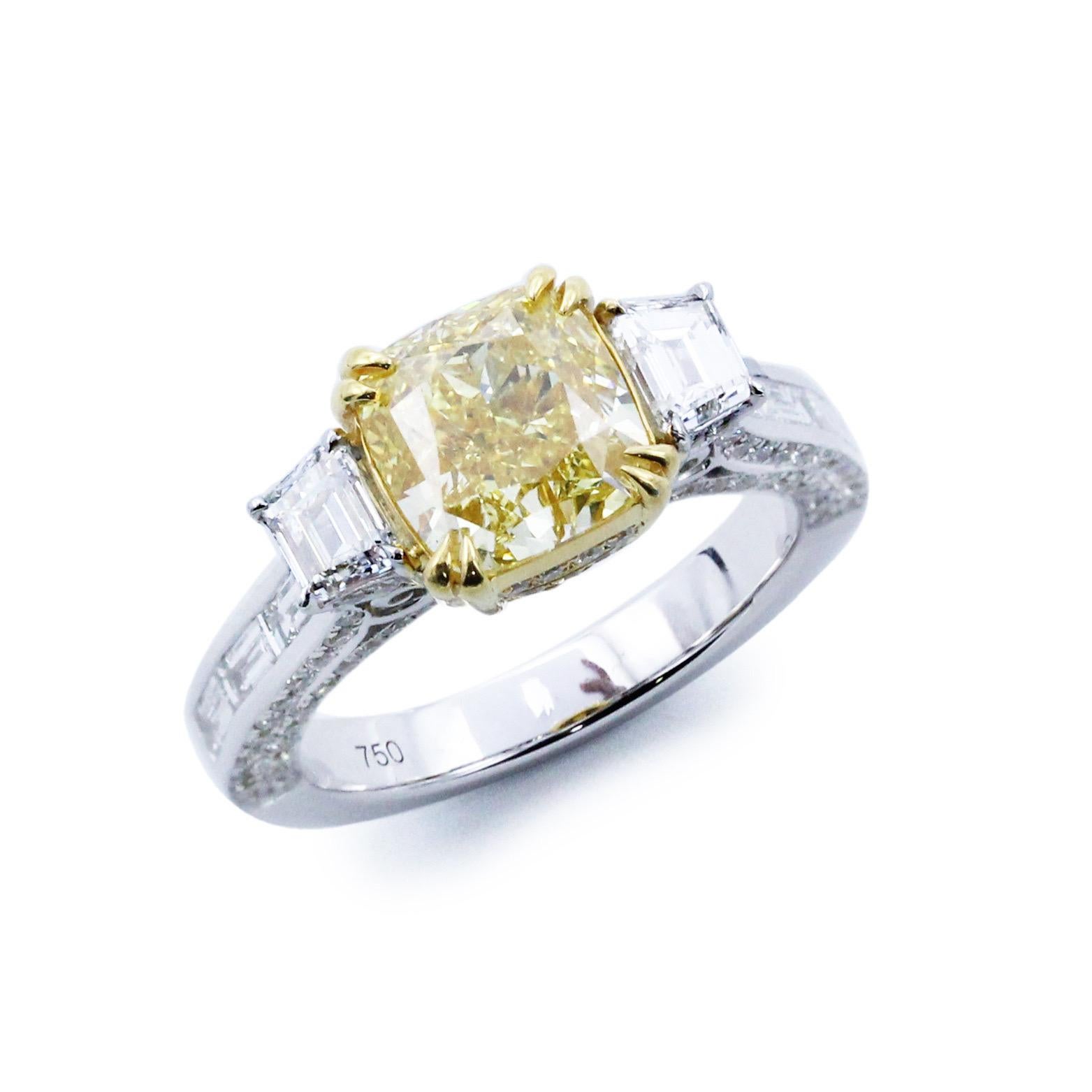 From The Vault at Emilio Jewelry Located on New York's iconic Fifth Avenue,
Showcasing a very special and rare Gia certified natural fancy intense yellow diamond of 3.00 carats set in the center. Set with an additional 1.60cts of colorless vs