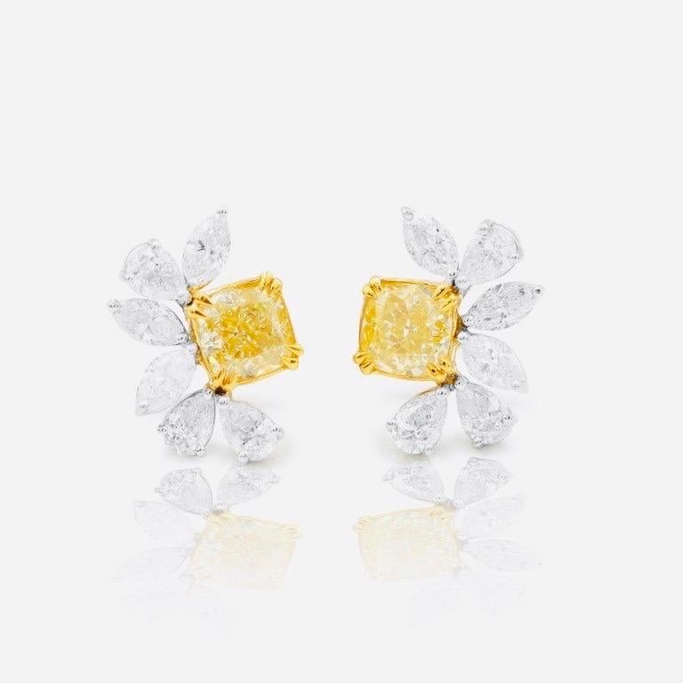 
From Emilio Jewelry, a well known and respected wholesaler/dealer located on New York’s iconic Fifth Avenue, 
Featuring 2 Gia Certified Fancy L. Yellow diamonds weighing just over 1 carat each, and an array of fancy cut diamonds totaling 4.78ct