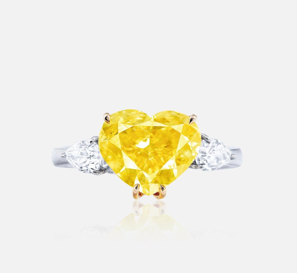 From Emilio Jewelry, a well known and respected wholesaler/dealer located on New York’s iconic Fifth Avenue, 
Featuring one of the most gorgeous 5.00 carat natural fancy intense yellow Diamond heart shaped diamonds. 
Please inquire for more images,