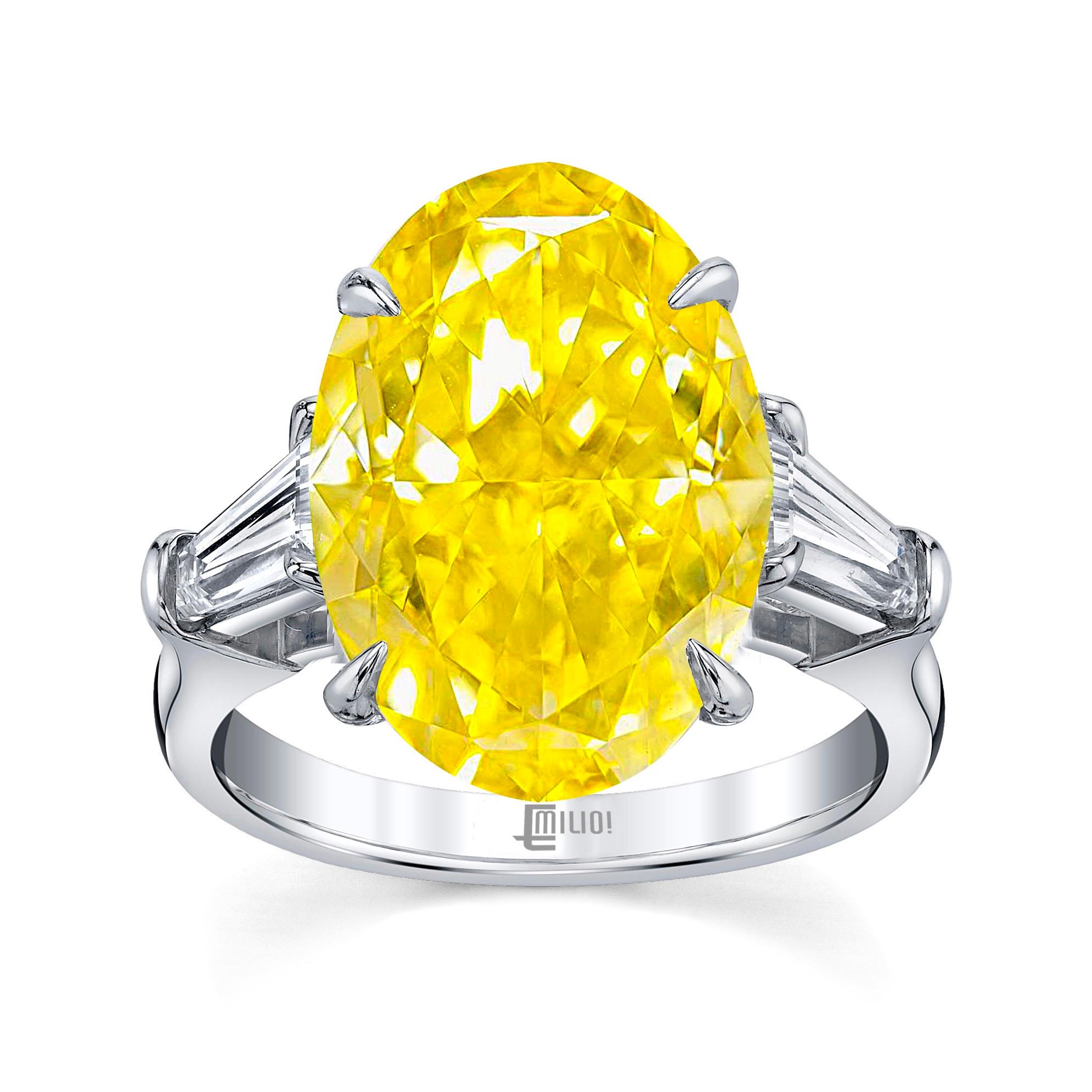 From the Museum vault at Emilio Jewelry, Located On New York’s Iconic Fifth Avenue:
Showcasing a magnificent center diamond. A Gia certified Vivid yellow oval diamond with no overtone. Vivid is the best color saturation grading possible, so this is