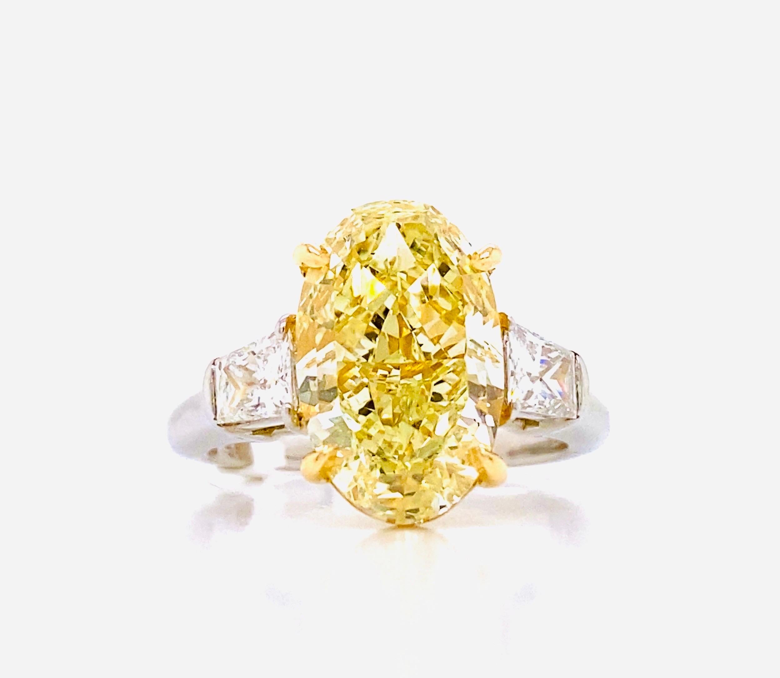 Oval Cut Emilio Jewelry GIA Certified 5.75 Carat Oval Fancy Yellow Diamond Ring For Sale