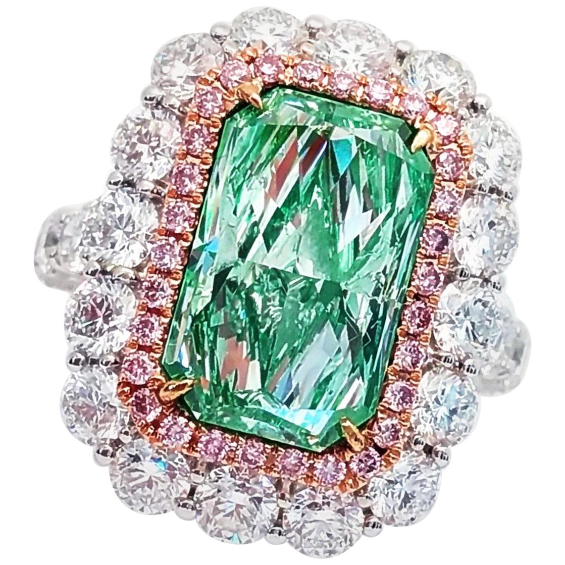 From the Emilio Jewelry Museum Vault, We are Showcasing a Gia certified natural fancy straight pure green diamond in the center weighing 6.35 carats alone. There are an additional 4.95 carats of white and pink diamonds. The diamond is exceptional