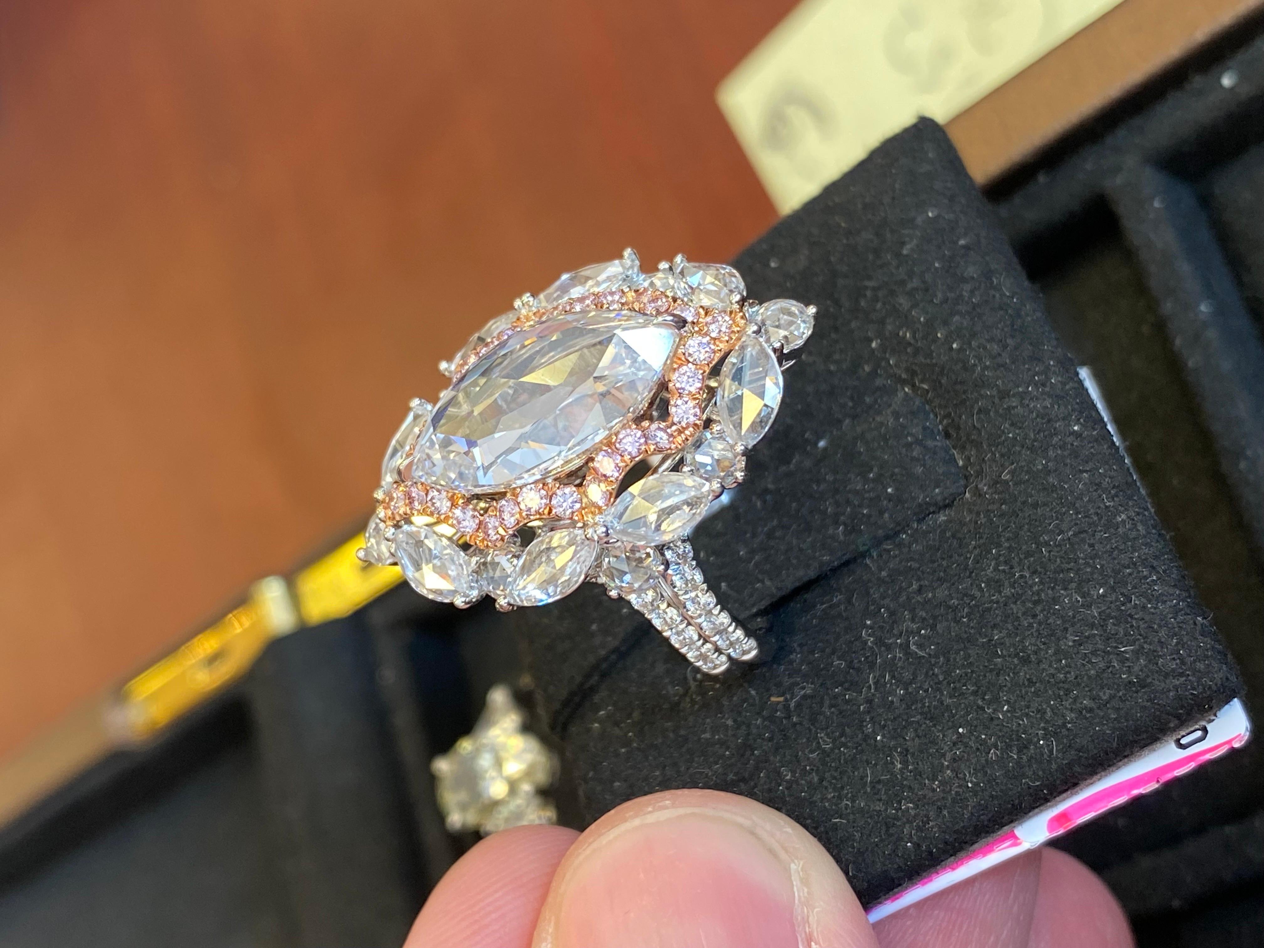 From Emilio Jewelry, a well known dealer and wholesaler located on New York's iconic Fifth Avenue,
Featuring a center unique diamond Gia Certified Rose cut Marquise, D color vvs2 clarity weighing just over 4.00 carats. The gorgeous mounting was