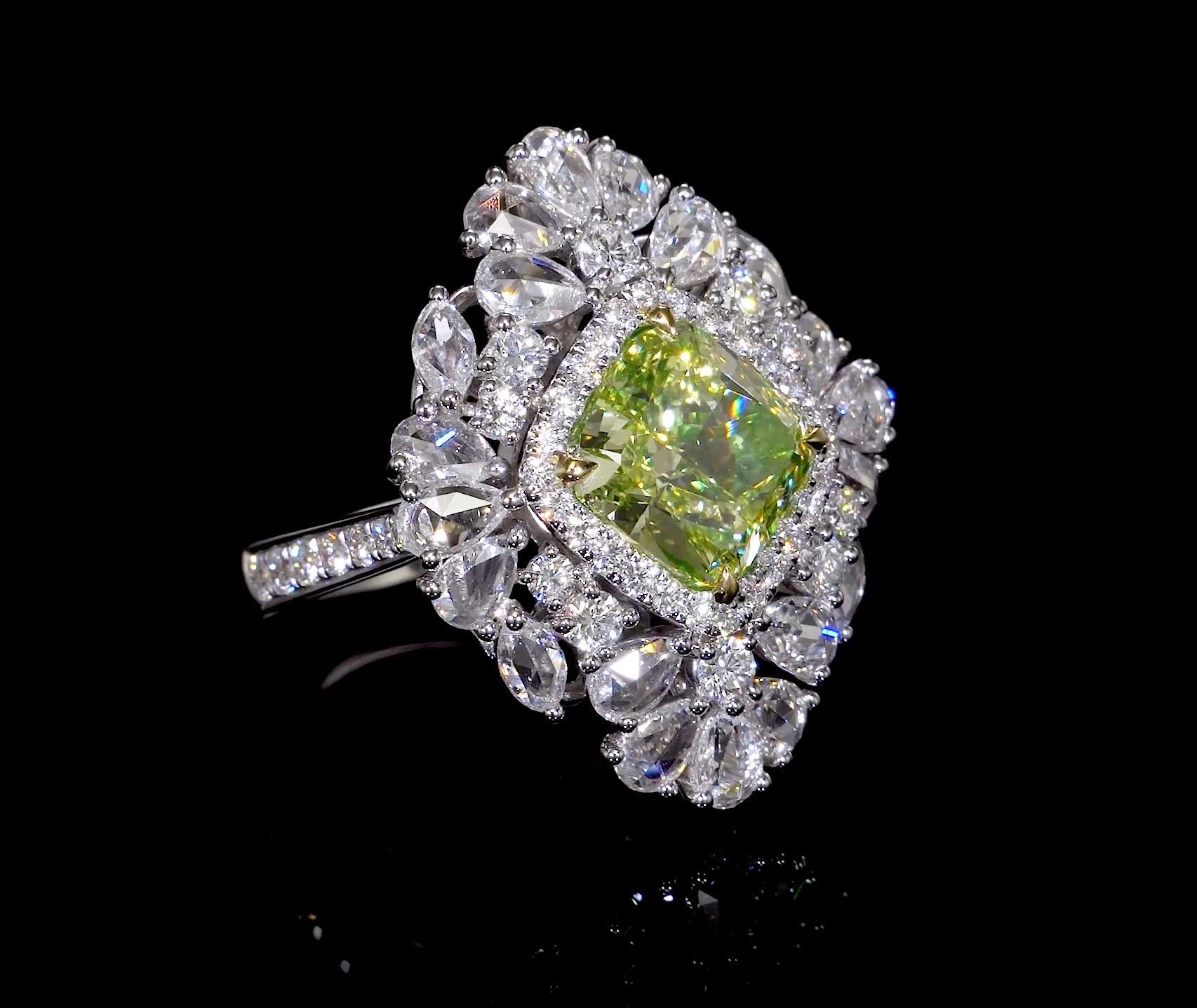 Another hand made masterpiece from the Museum Vault At Emilio Jewelry, located on New York's iconic Fifth Avenue.
Featuring a magnificent Gia certified Fancy Intense Green Yellow Diamond set in the center dazzled with pear shaped rose cut, and