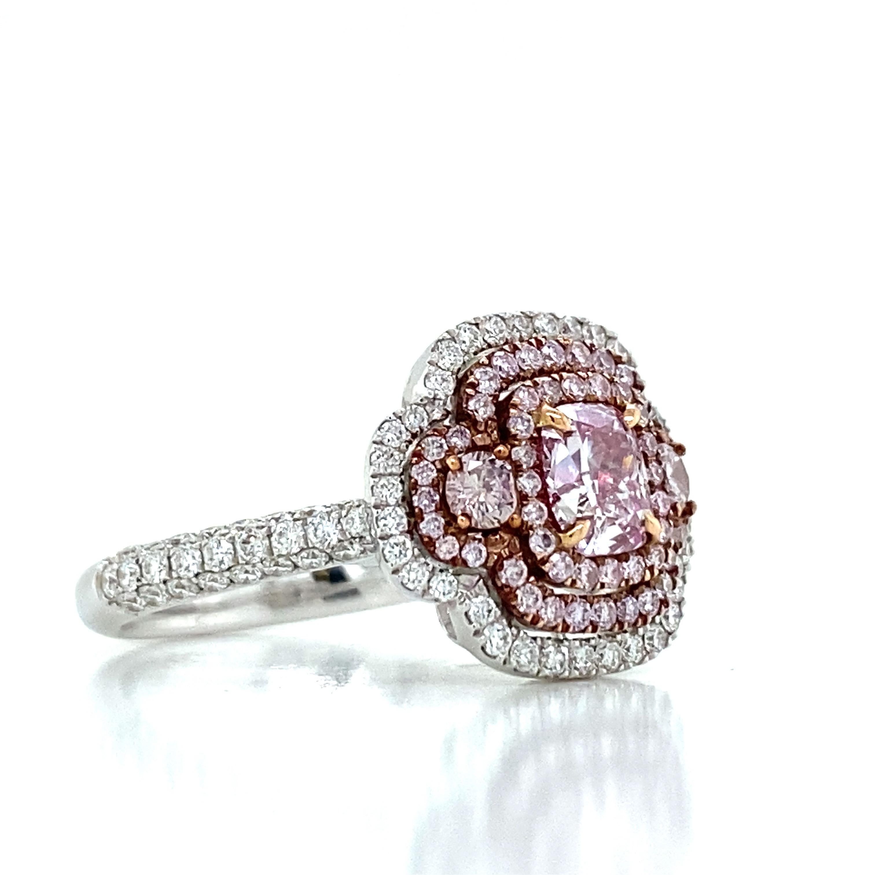 From the Vault at Emilio Jewelry Located on New York's iconic 5th Avenue,
Featuring a center diamond Gia certified Natural Very light pink diamond with no overtone .70ct and a clarity of vvs2. Very special hand made ring mounting with additional