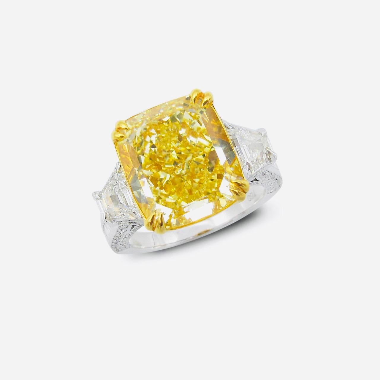 From The Museum Vault At Emilio Jewelry New York,
A magical ring featuring a center Gia certified fancy intense yellow diamond with no overtone weighing over 7.25 carats! Please inquire for exact details. 
  Emilio Jewelry created this magnificent