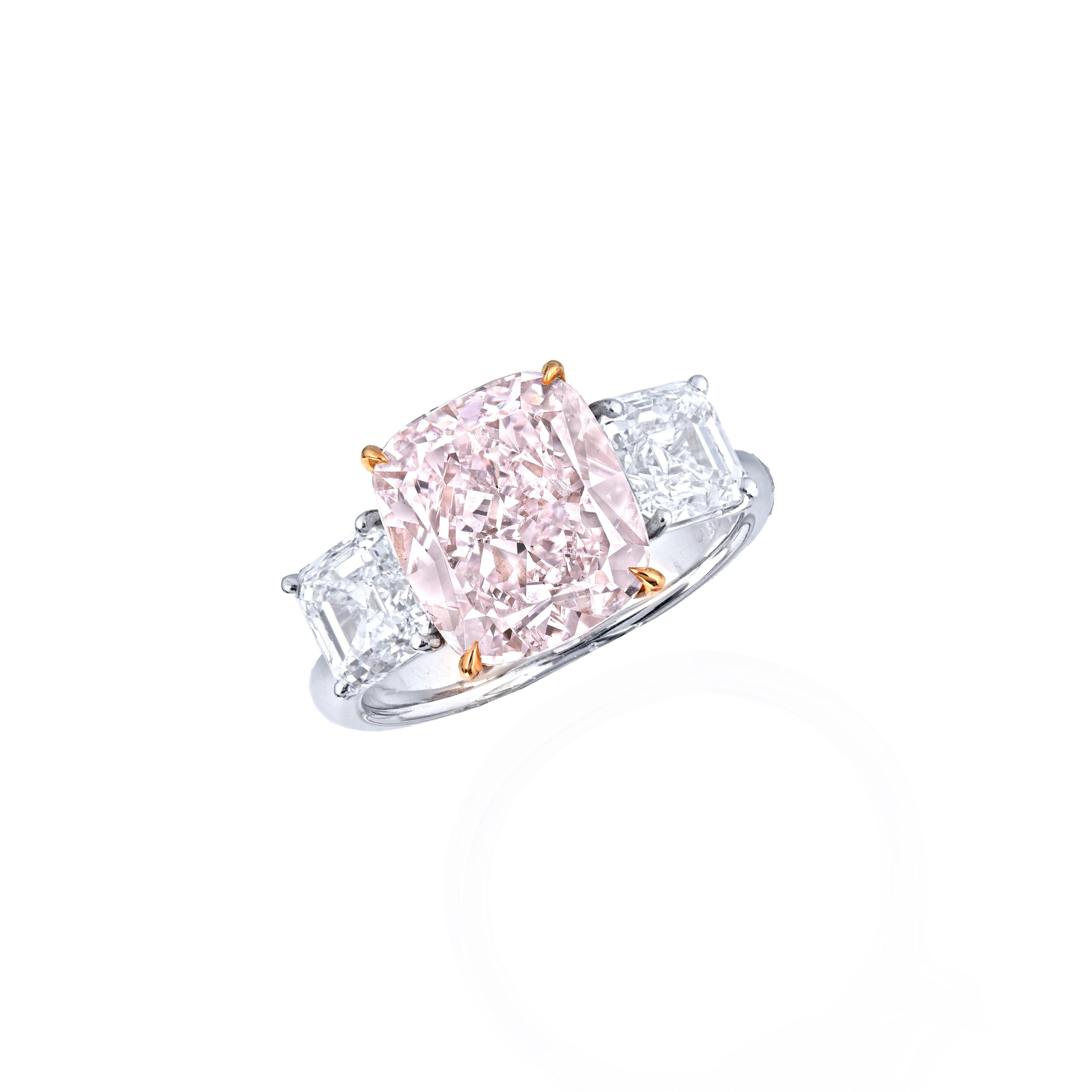From Emilio Jewelry, a well known and respected wholesaler/dealer located on New York’s iconic Fifth Avenue, 
Sitting in the center of this magnificent investment ring is a natural Gia Certified Pink diamond weighing 5.50 carats. The hand made