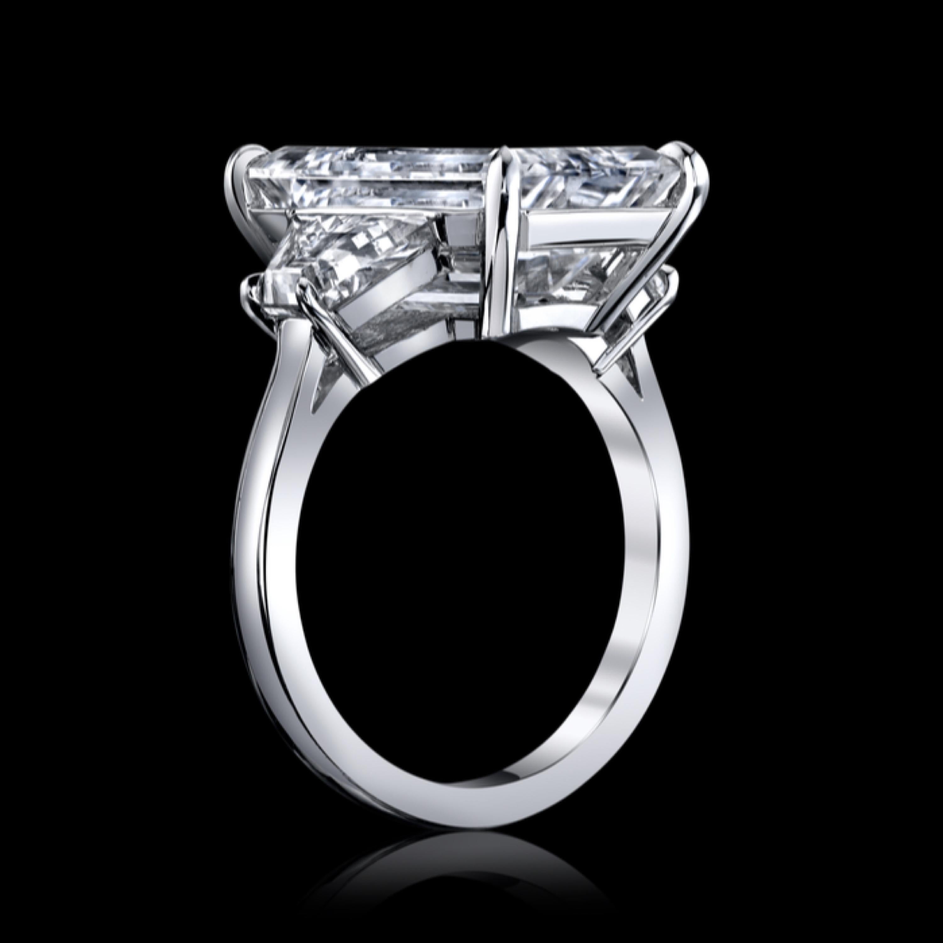 From the Emilio Jewelry Vault, Showcasing a stunning Gia certified 9ct colorless emerald cut center diamonds. 
If you have another dream design, we can recreate this ring to your dream ring by providing drawings, realistic renderings for approval,
