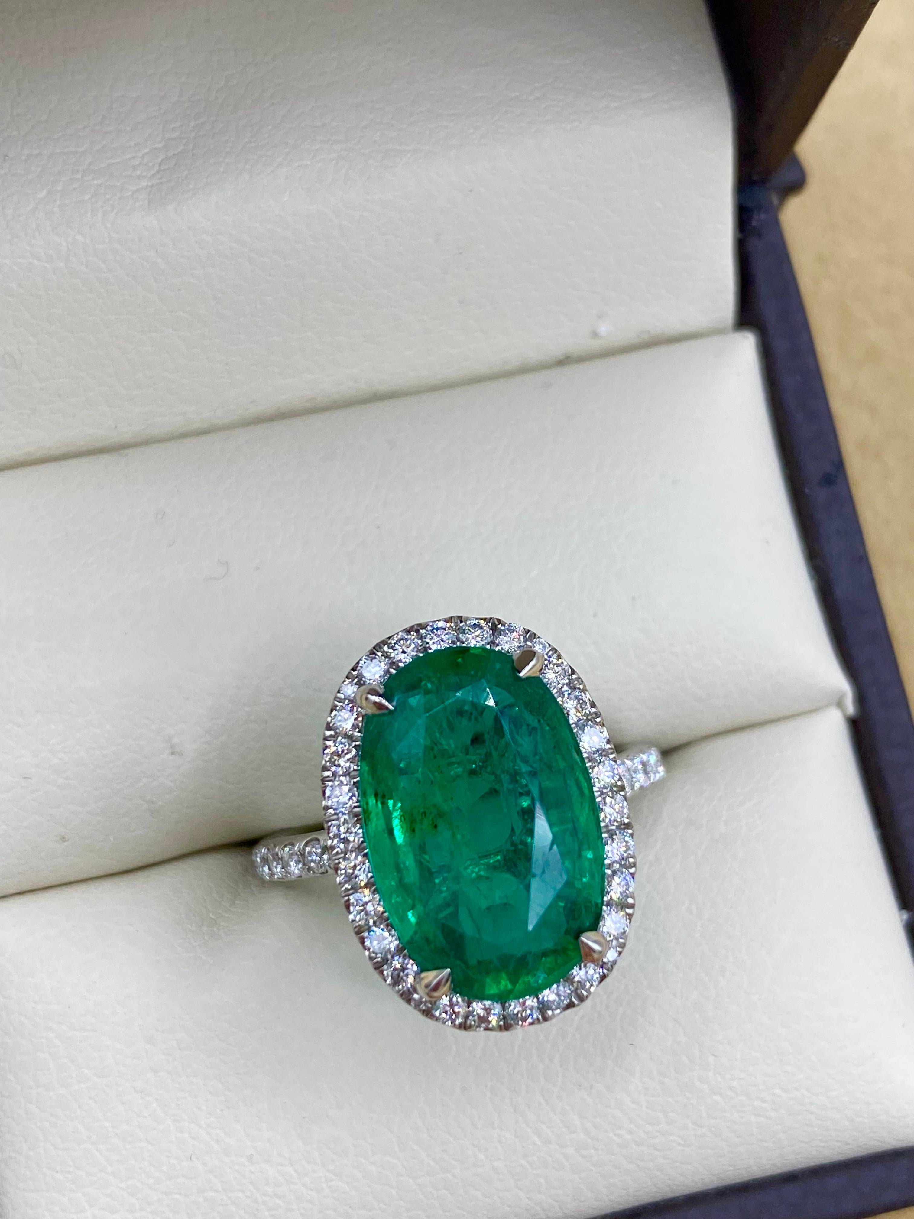 From the vault at Emilio Jewelry located on New York's iconic Fifth Avenue,
A very special and unique 5.62 carat Zambian emerald serves as the focal point of this ring. What makes this ring really special is the unique elongated cushion shape and