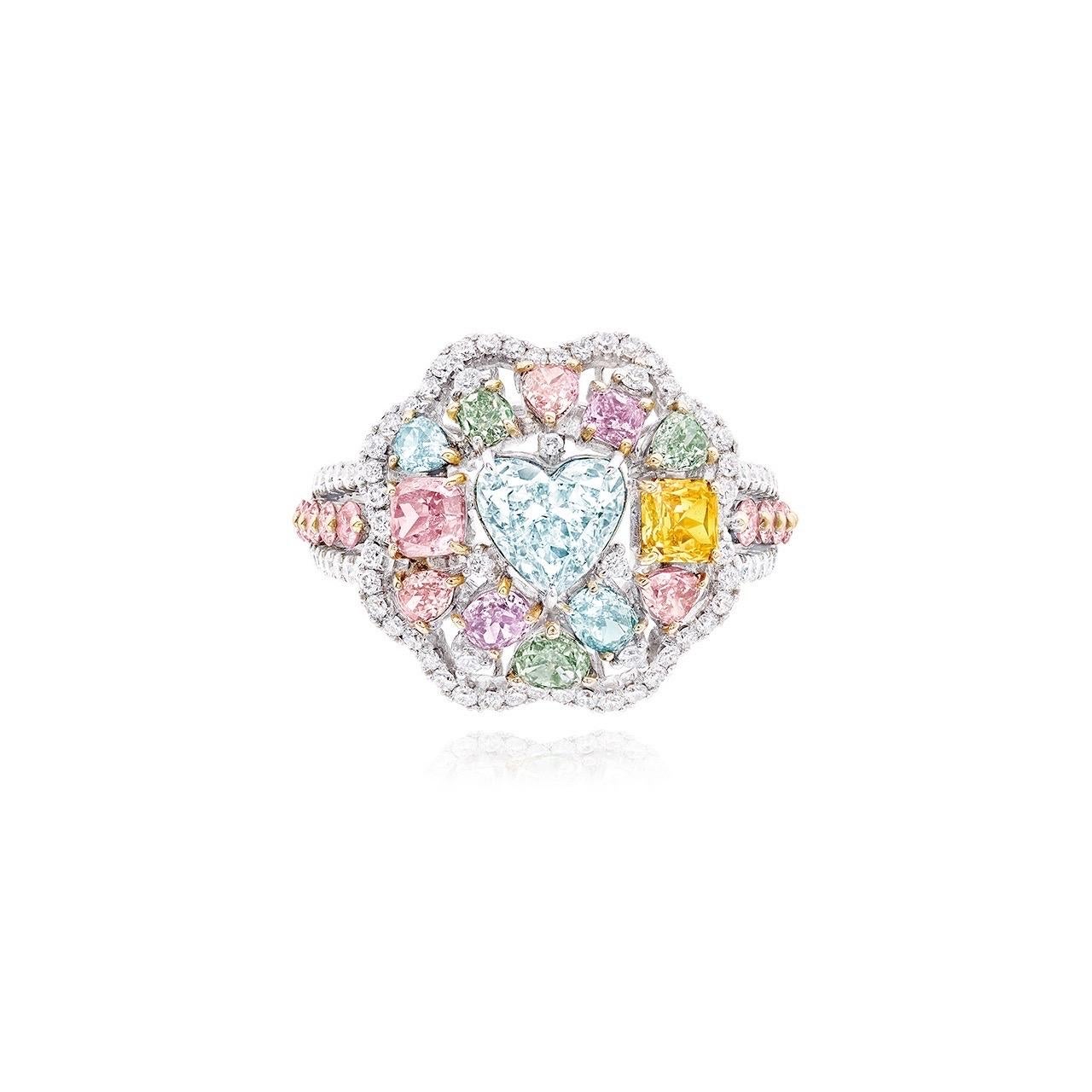 Main stone: 1.00+ carat Very Light Blue, SI2, Heart
A truly unique and special ring featuring an array of natural fancy color diamonds. 
Setting: 12 fancy colored diamonds totaling approximately 1.48 carats, 10 round pink diamonds totaling
