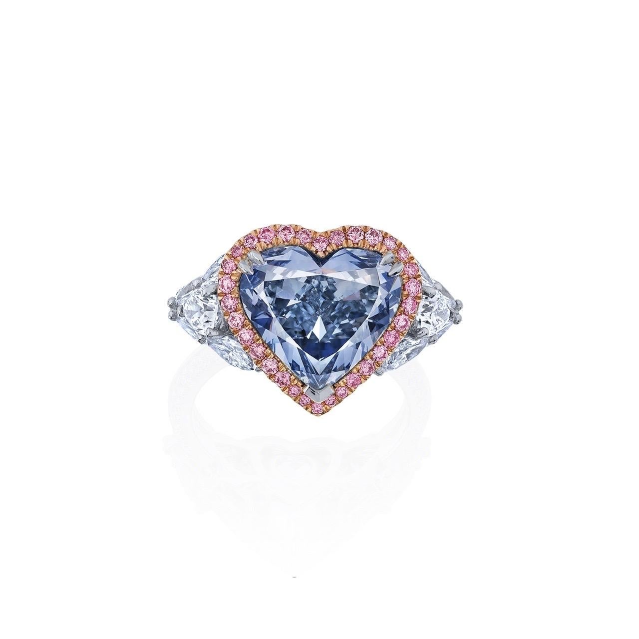 Main stone: 4.00 carat Fancy Grayish Blue, SI2, Heart

Setting: 32 pink diamonds totaling approximately 0.23 carats, 2 pear-cut white diamonds totaling approximately 0.47 carats, 8 marquise-cut white diamonds totaling approximately 1.02 carats, 48