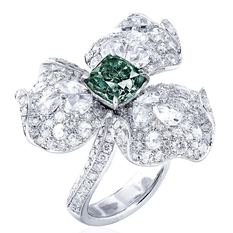 From the Museum Vault at Emilio Jewelry New York,
Main stone: Gia certified natural fancy deep green with no overtone,  1.90 carats Fancy Deep Green cushion.
Setting: 229 white diamonds totaling approximately 2.147 carats, 20 rose-cut white diamonds