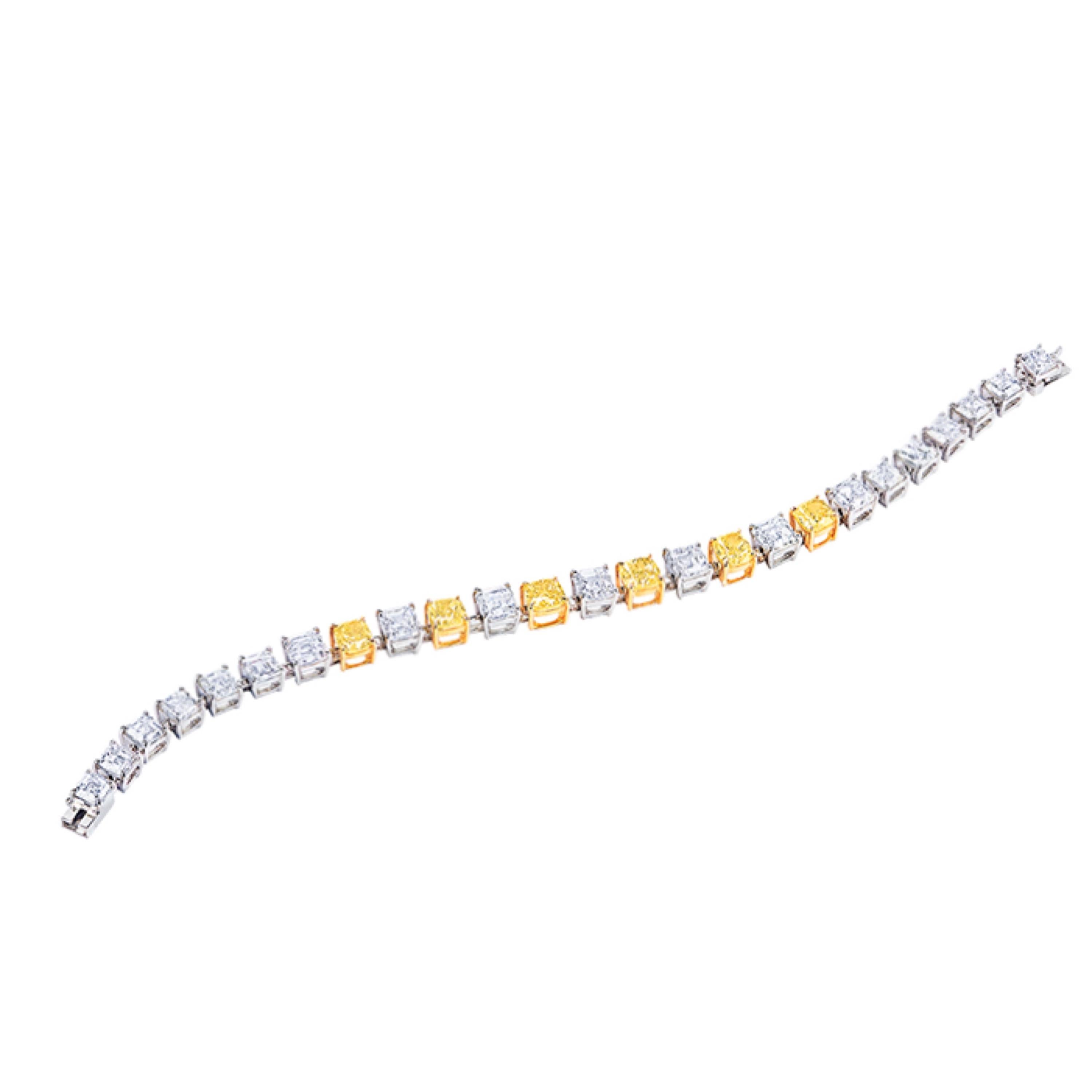 From the Emilio Jewelry Atelier in New York, 
Main stone: 6 fancy yellow diamonds with a total of about 4.74 carats Fancy Intense Yellow ~ Fancy Yellow CUSHION
Setting: 19 fancy-cut white diamonds totaling approximately 12.39 carats D~G IF~VS1