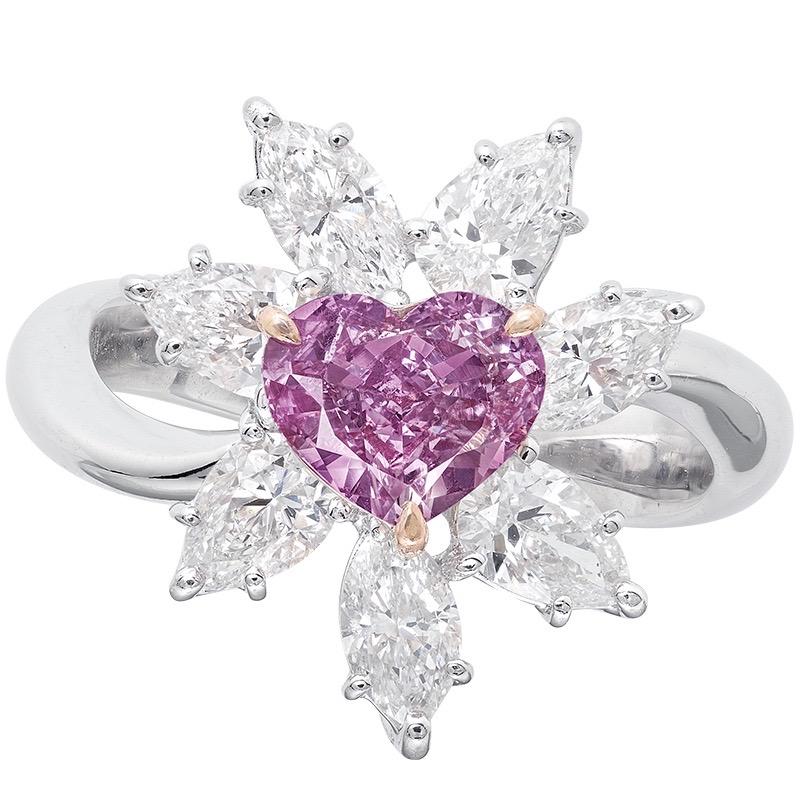 Showcasing a Gia certified 1 carat + natural fancy intense green pinkish purple diamond of exceptional purple color. The primary color according to Gia is natural purple. Natural purple diamonds are the rarest of all colors. 
This piece was Hand