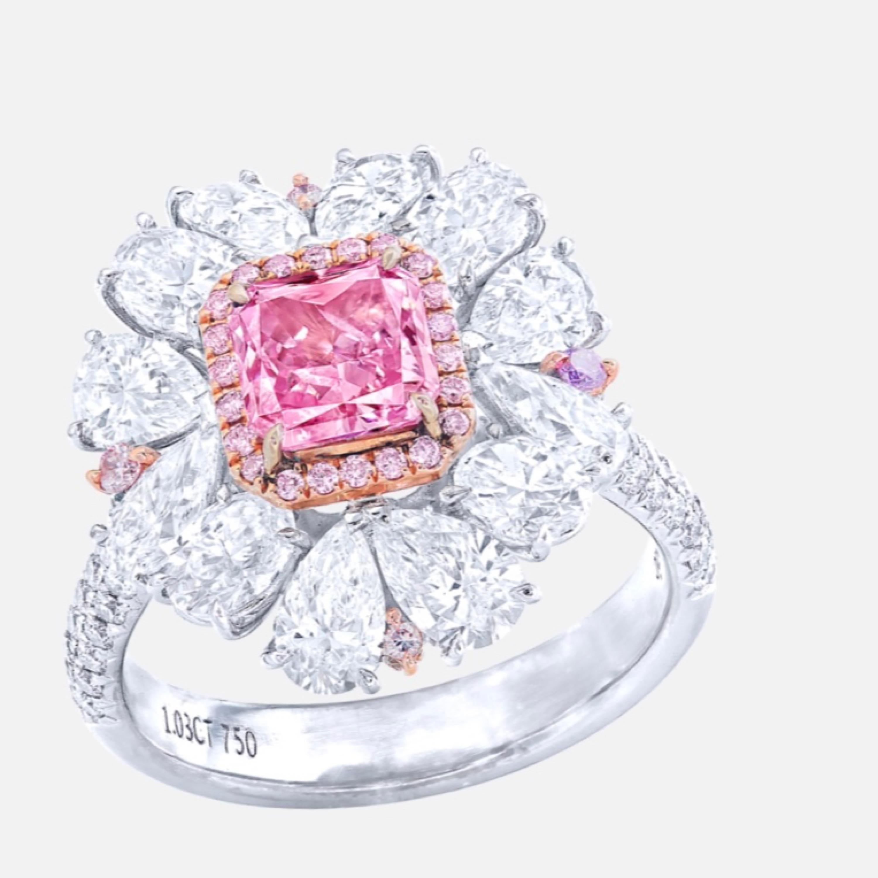 From the Museum vault at Emilio Jewelry, Located On New York’s Iconic Fifth Avenue:
Showcasing a magnificent natural Gia certified natural Fancy Intense Purplish Pink diamond in the center weighing just over 1 carat. This ultra rare center stone has