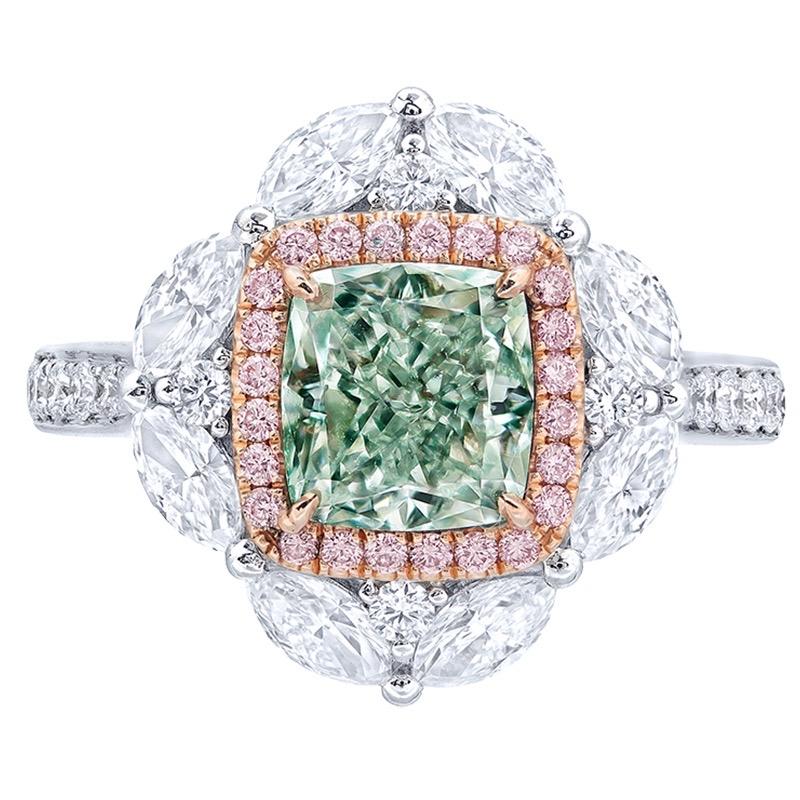 From the Museum vault at Emilio Jewelry in New York,
Main stone: 2.00 carats Fancy Light Green. Pure green color with no overtone makes this diamond ring special enough to put inside the Museum vault. 
Setting: 24 pink diamonds with a total of about