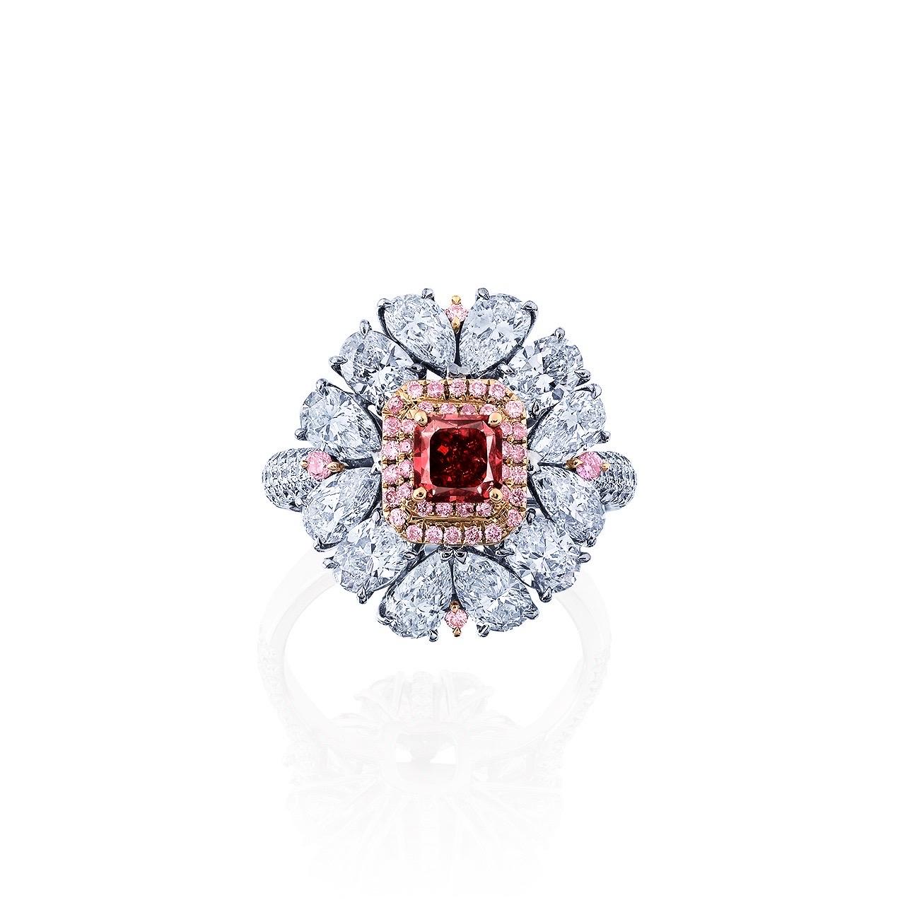 Main stone: just over 0.50 carat Fancy Red,
 Cut-Cornered Square
Setting: 58 round white diamonds totaling approximately 0.39 carats, 8 pear-cut white diamonds totaling approximately 1.88 carats, 4 oval-cut white diamonds totaling approximately 0.95