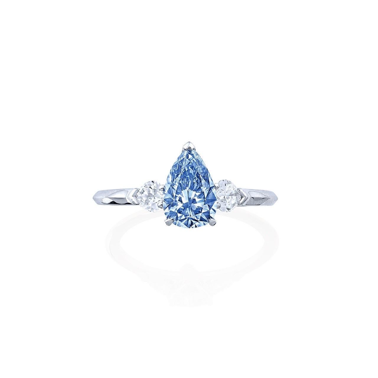 Main stone: 1.00++ carat Fancy Vivid Blue, VS2, Pear
Teardrop 
Setting: white diamonds totaling approximately 0.60 carats
From Emilio Jewelry, a well known and respected wholesaler/dealer located on New York’s iconic Fifth Avenue, 

Please inquire