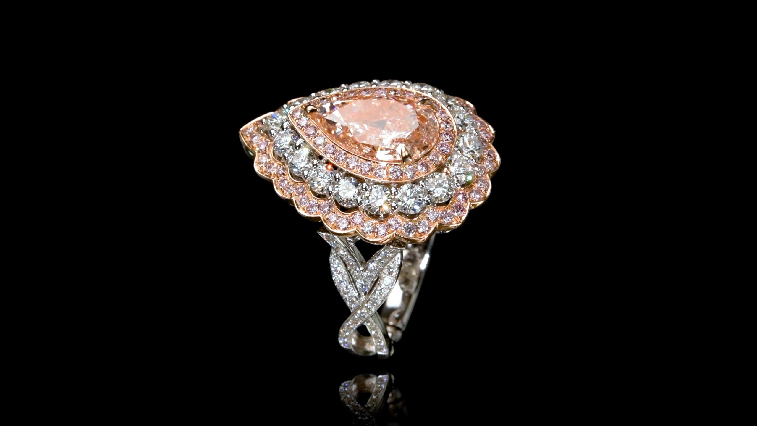 From Emilio Jewelry, a well known and respected wholesaler/dealer located on New York’s iconic Fifth Avenue, 
A very special Pink diamond dazzles and stuns weighing just over 2.50 carats. Set with colorless and pink diamonds in 18k gold. 

Please