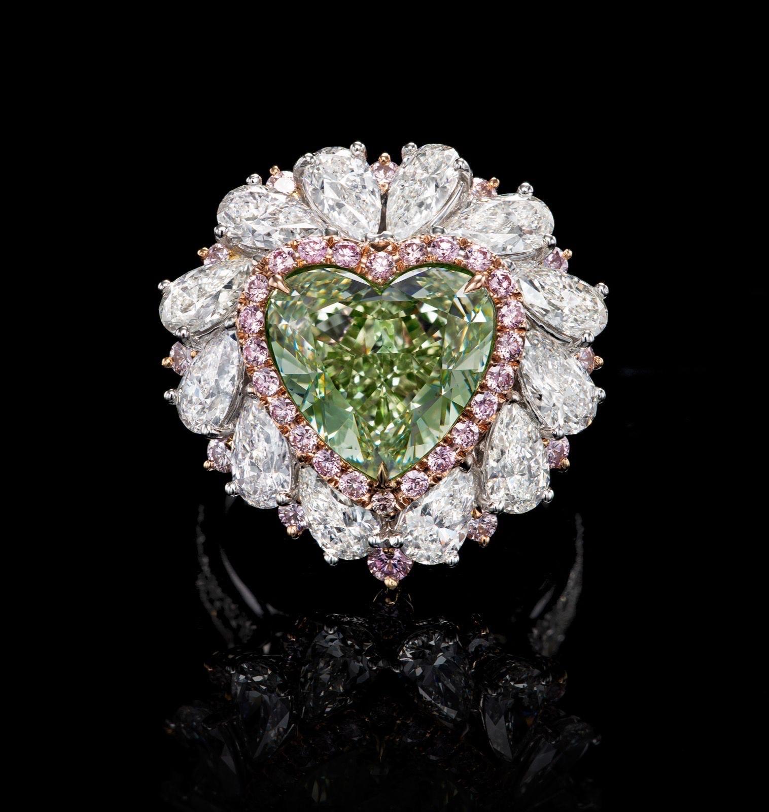 From The Museum Vault at Emilio Jewelry Located on New York's iconic Fifth Avenue,
Showcasing a very special and rare Gia certified natural fancy intense Green heart shape over 6.00 astonishing carats set in the center. 
We specialize in creating