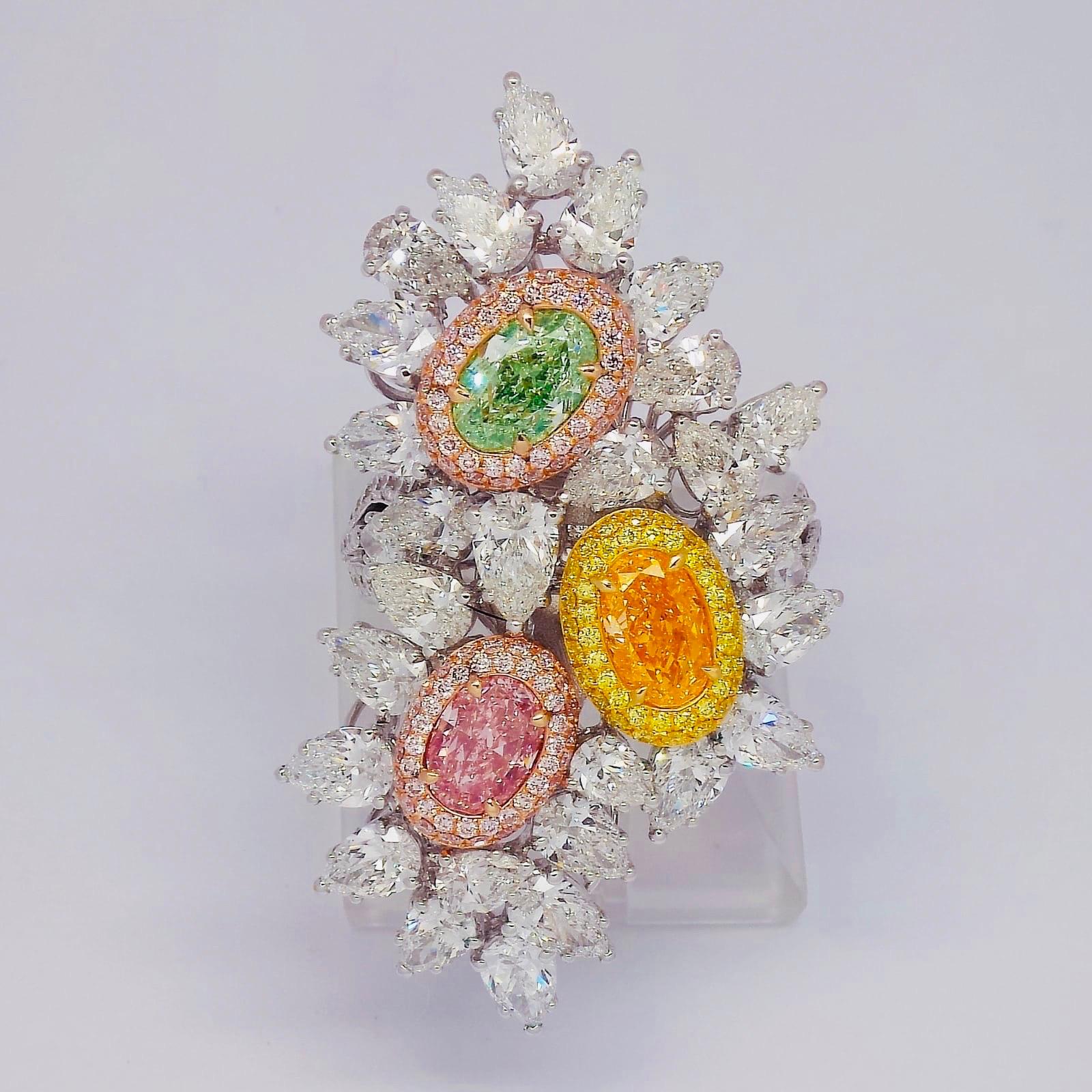 From the Emilio Jewelry Museum Vault, Showcasing a 3 magnificent investment grade diamonds. Set with center stones all Gia certified 
1.00 carat natural green diamond
1.00 carat natural pink diamond 
1.00 carat natural orange diamond 
Please inquire